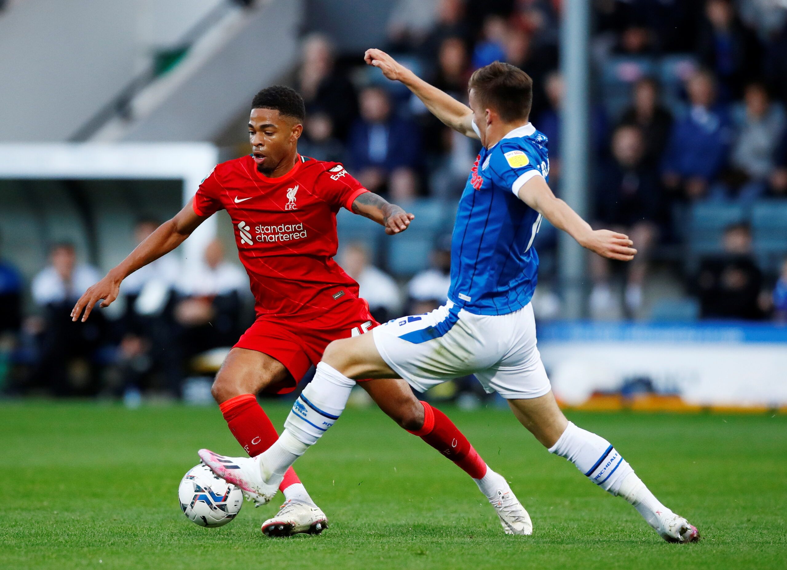 Soccer Football - EFL Trophy - Group Stage - Northern Group D - Rochdale v Liverpool U21 - Spotland Stadium, Rochdale, Britain - August 31, 2021  Liverpool's Elijah Dixon-Bonner in action with Rochdale's George Broadbent  Action Images/Jason Cairnduff  EDITORIAL USE ONLY. No use with unauthorized audio, video, data, fixture lists, club/league logos or 