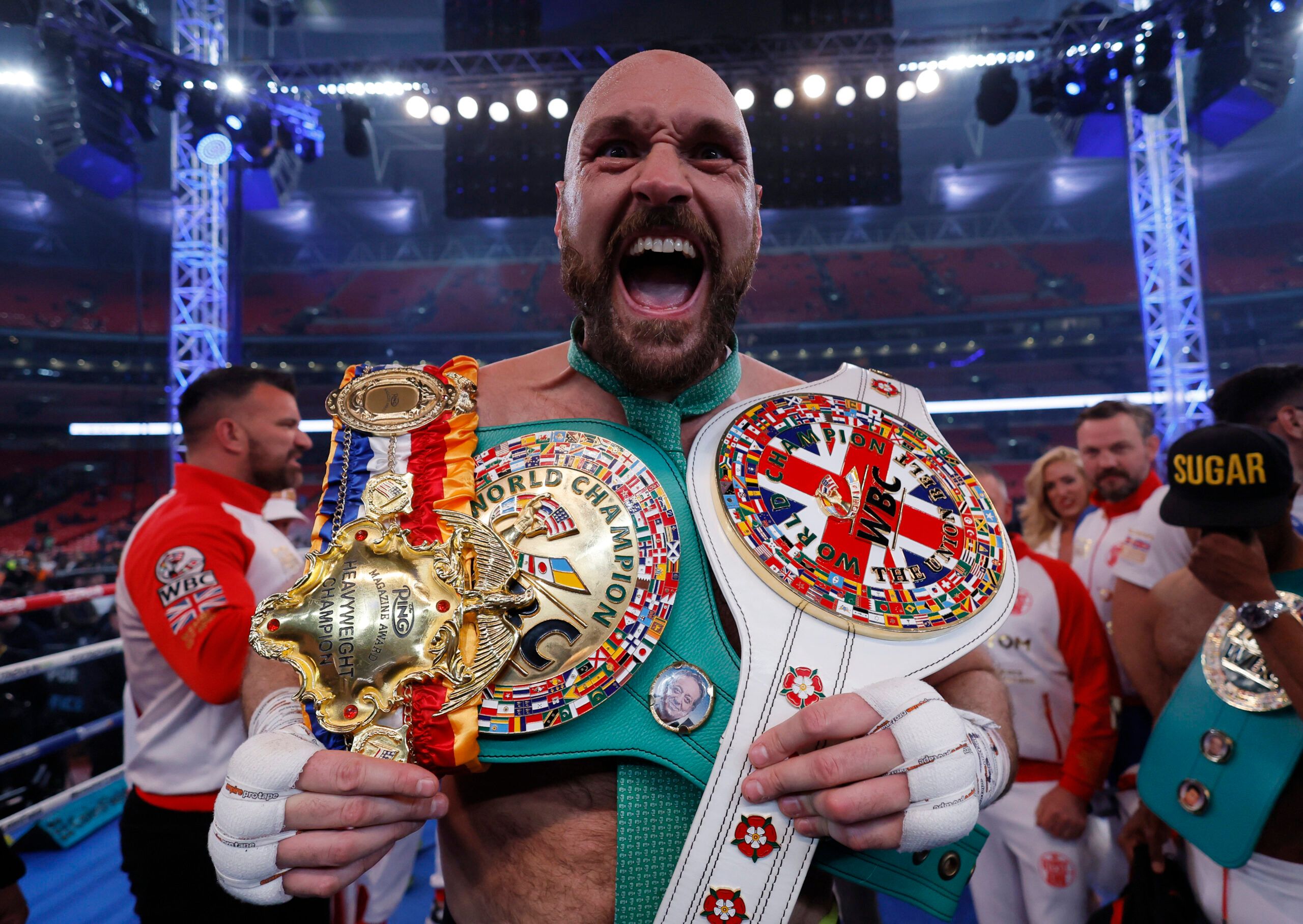 Boxing - Tyson Fury v Dillian Whyte - WBC World Heavyweight Title - Wembley Stadium, London, Britain - April 23, 2022  Tyson Fury celebrates with the belts after winning his fight against Dillian Whyte Action Images via Reuters/Andrew Couldridge