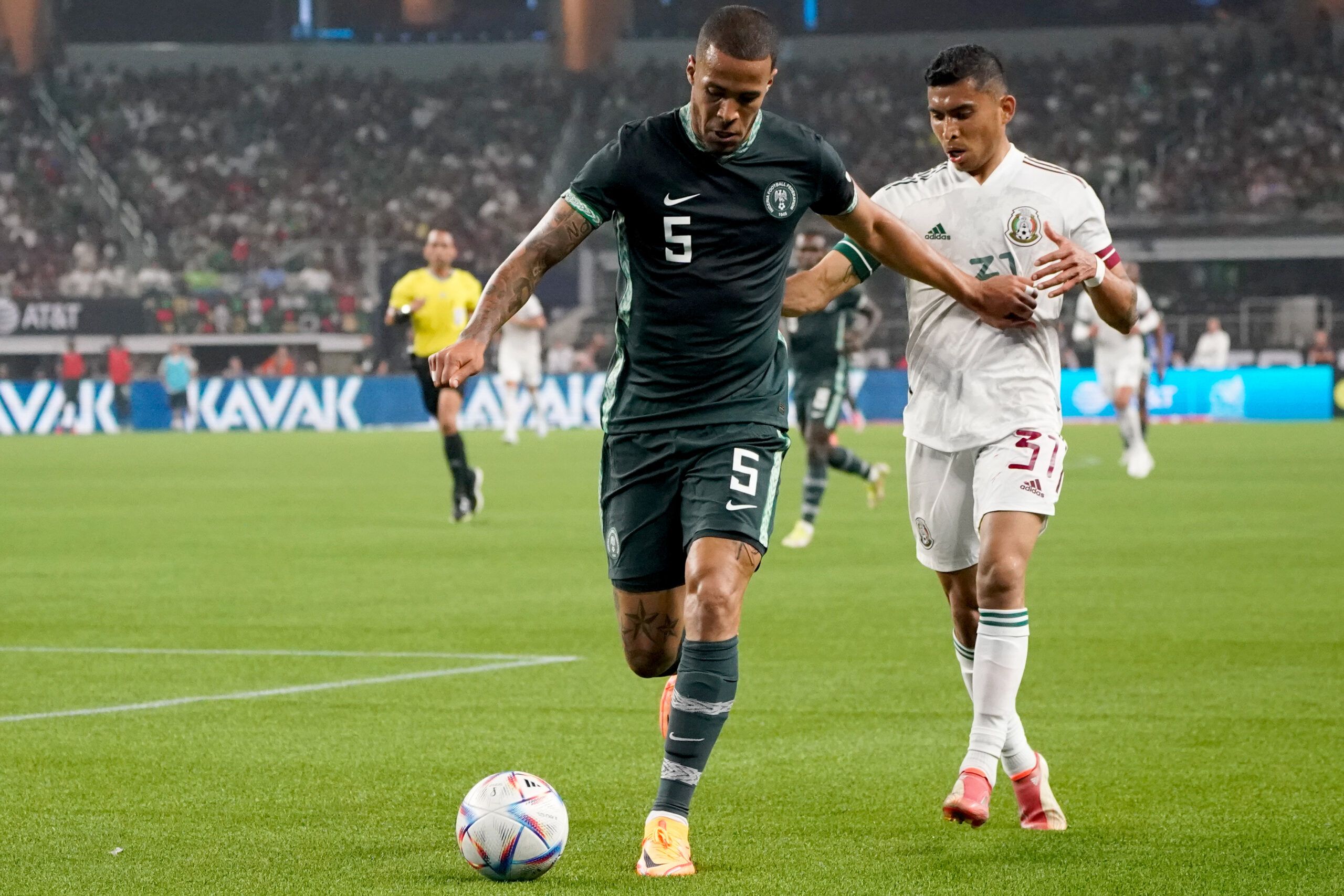May 28, 2022; Arlington, TX, USA; Nigeria defender William Troost-Ekong (5) and Mexico midfielder Orbelin Pineda (31) fight for possession of the ball during the second half at AT&amp;T Stadium. Mandatory Credit: Chris Jones-USA TODAY Sports