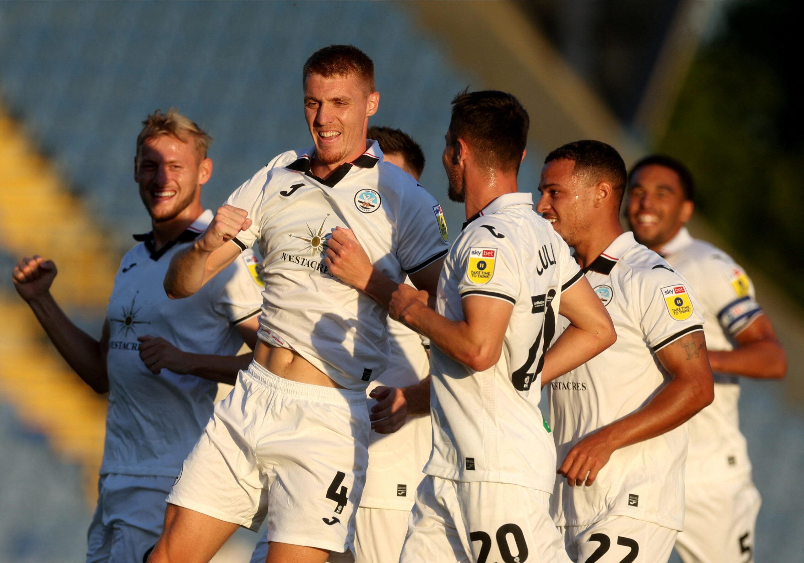 Soccer Football - Carabao Cup - Oxford United v Swansea City - Kassam Stadium, Oxford, Britain - August 9, 2022  Swansea City's Jay Fulton celebrates scoring their first goal with teammates  Action Images/Paul Childs  EDITORIAL USE ONLY. No use with unauthorized audio, video, data, fixture lists, club/league logos or 
