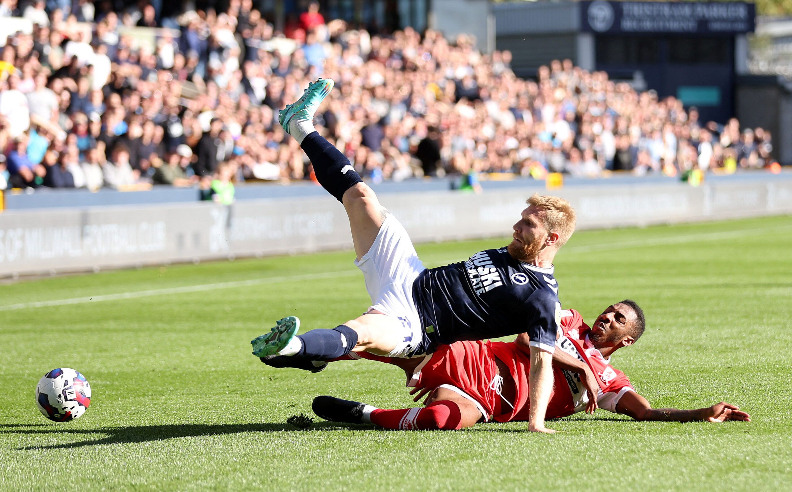 Soccer Football - Championship - Millwall v Middlesbrough - The Den, London, Britain - October 8, 2022 Millwall?s Andreas Voglsammer in action with Middlesbrough?s Isaiah Jones  Action Images/Matthew Childs  EDITORIAL USE ONLY. No use with unauthorized audio, video, data, fixture lists, club/league logos or 