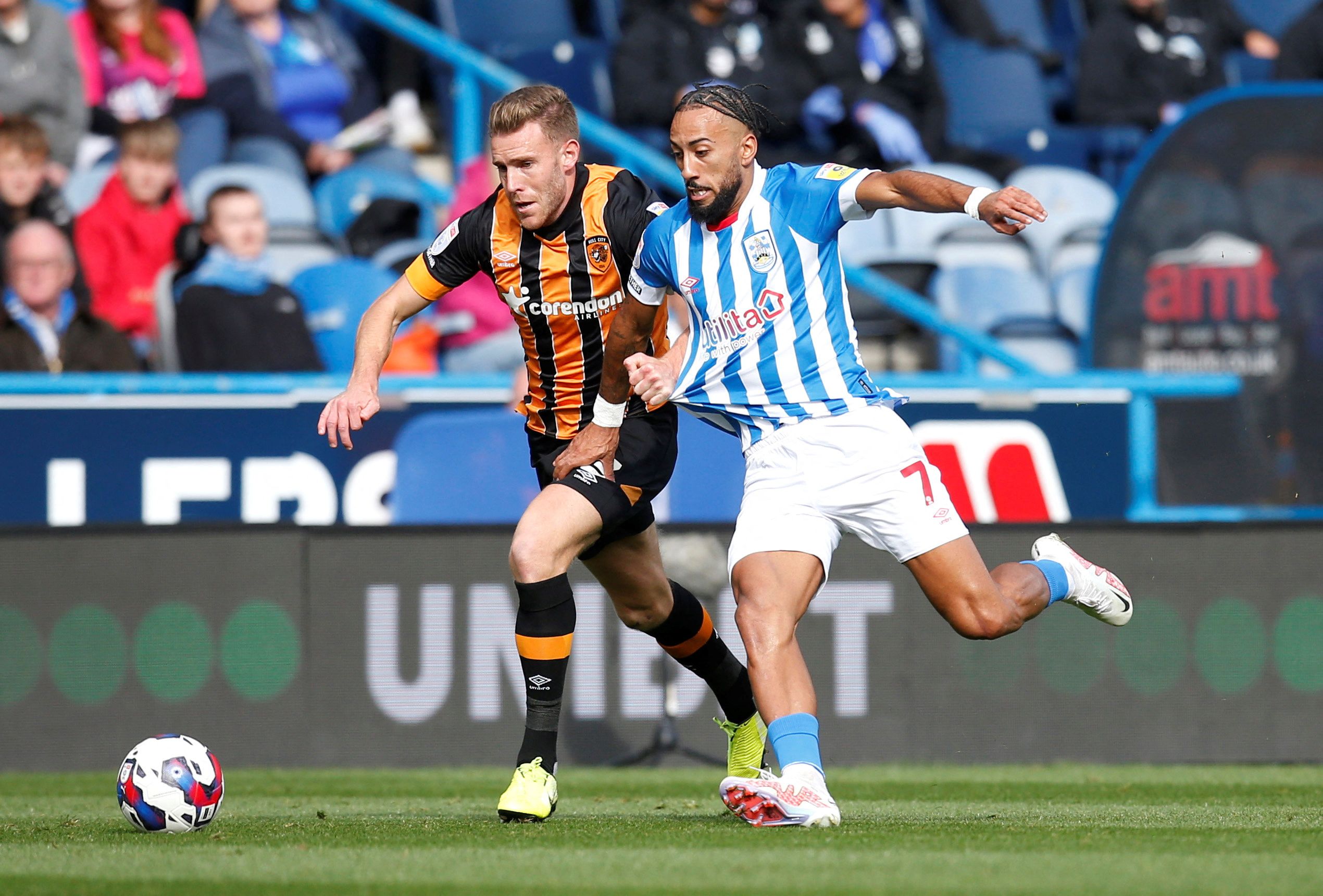 Soccer Football - Championship - Huddersfield Town v Hull City - John Smith's Stadium, Huddersfield, Britain - October 9, 2022 Huddersfield Town's Sorba Thomas in action with Hull City's Callum Elder  Action Images/Ed Sykes  EDITORIAL USE ONLY. No use with unauthorized audio, video, data, fixture lists, club/league logos or 