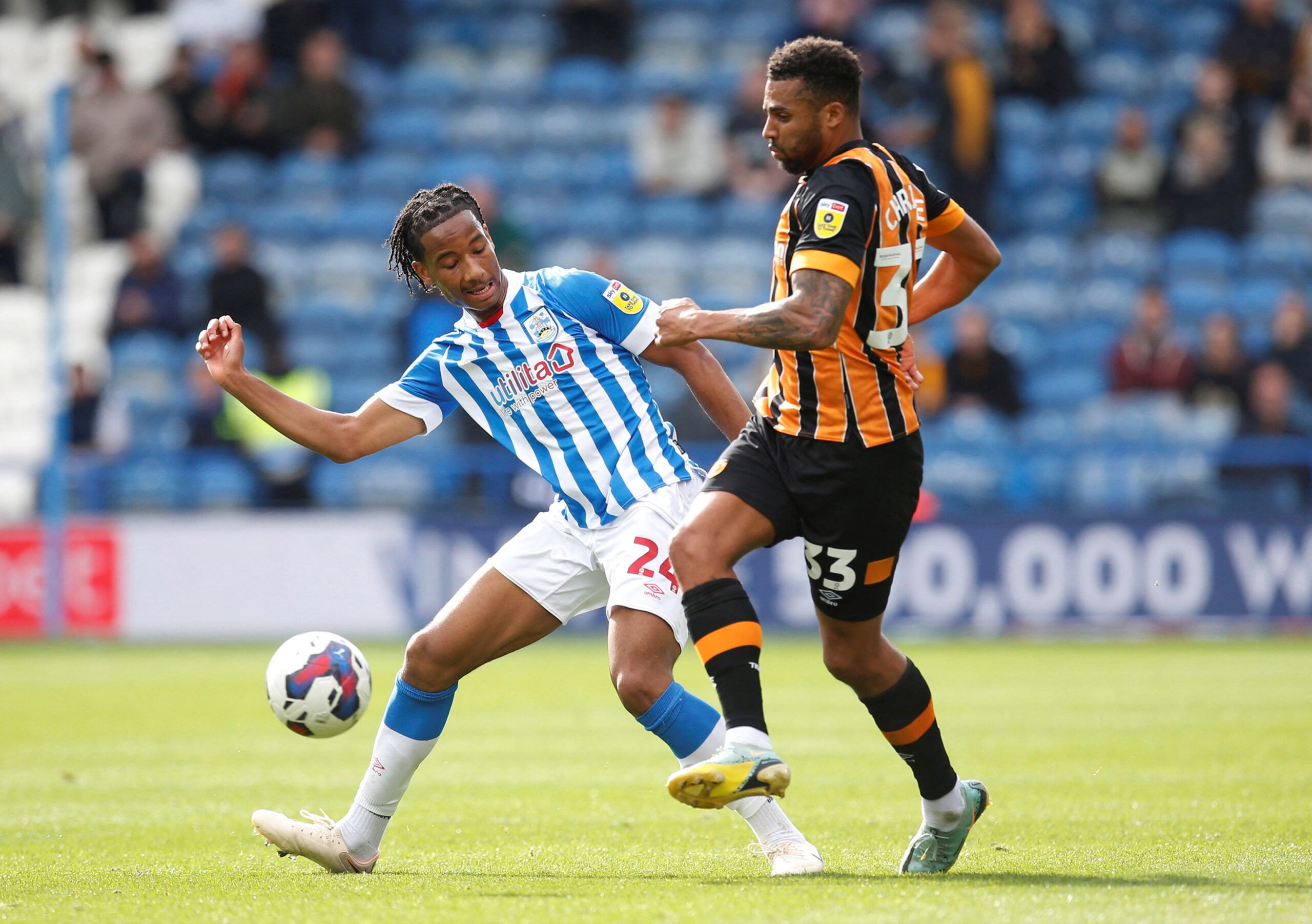 Soccer Football - Championship - Huddersfield Town v Hull City - John Smith's Stadium, Huddersfield, Britain - October 9, 2022 Huddersfield Town's Etienne Camara in action with Hull City's Cyrus Christie Action Images/Ed Sykes  EDITORIAL USE ONLY. No use with unauthorized audio, video, data, fixture lists, club/league logos or 
