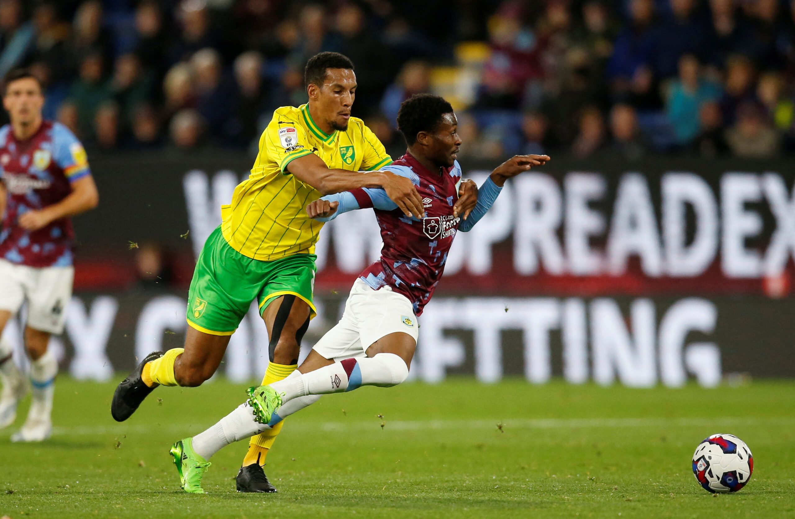 Soccer Football - Championship - Burnley v Norwich City - Turf Moor, Burnley, Britain - October 25, 2022 Norwich City's Isaac Hayden in action with Burnley's Nathan Tella Action Images/Ed Sykes  EDITORIAL USE ONLY. No use with unauthorized audio, video, data, fixture lists, club/league logos or 