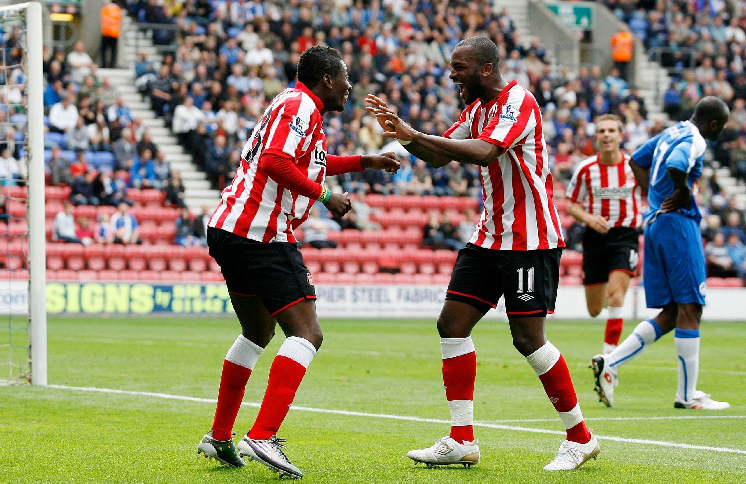 Football - Wigan Athletic v Sunderland Barclays Premier League - DW Stadium - 10/11 - 11/9/10 
Asamoah Gyan (L) celebrates with Darren Bent after scoring Sunderland's first goal 
Mandatory Credit: Action Images / Paul Thomas 
Livepic 
NO ONLINE/INTERNET USE WITHOUT A LICENCE FROM THE FOOTBALL DATA CO LTD. FOR LICENCE ENQUIRIES PLEASE TELEPHONE +44 (0) 207 864 9000.