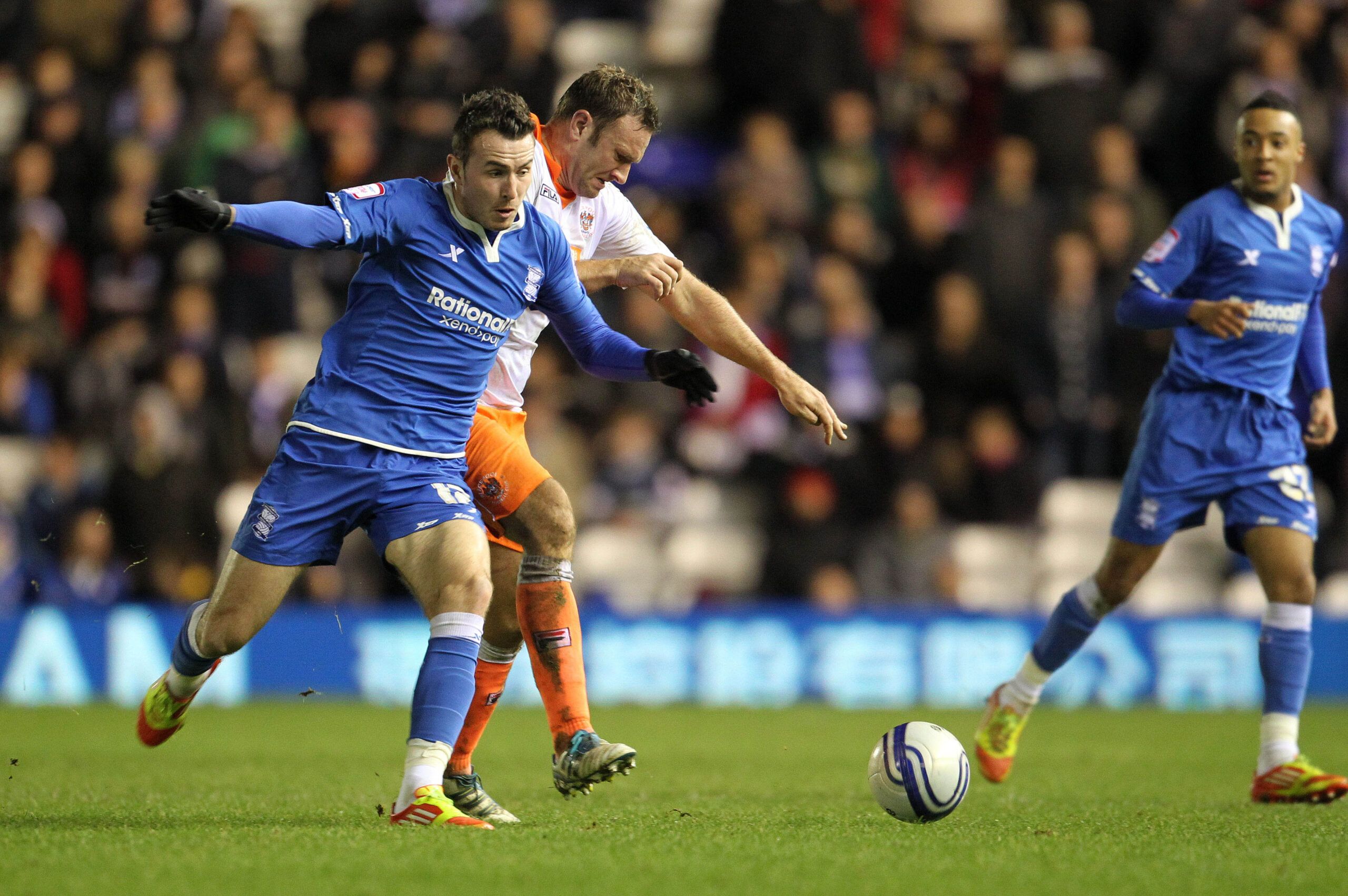 Football - Birmingham City v Blackpool npower Football League Championship - St Andrews - 31/12/11 
Jordon Mutch of Birmingham City (L) and Ian Evatt of Blackpool in action 
Mandatory Credit: Action Images / John Clifton 
Livepic 
EDITORIAL USE ONLY. No use with unauthorized audio, video, data, fixture lists, club/league logos or live services. Online in-match use limited to 45 images, no video emulation. No use in betting, games or single club/league/player publications.  Please contact your ac