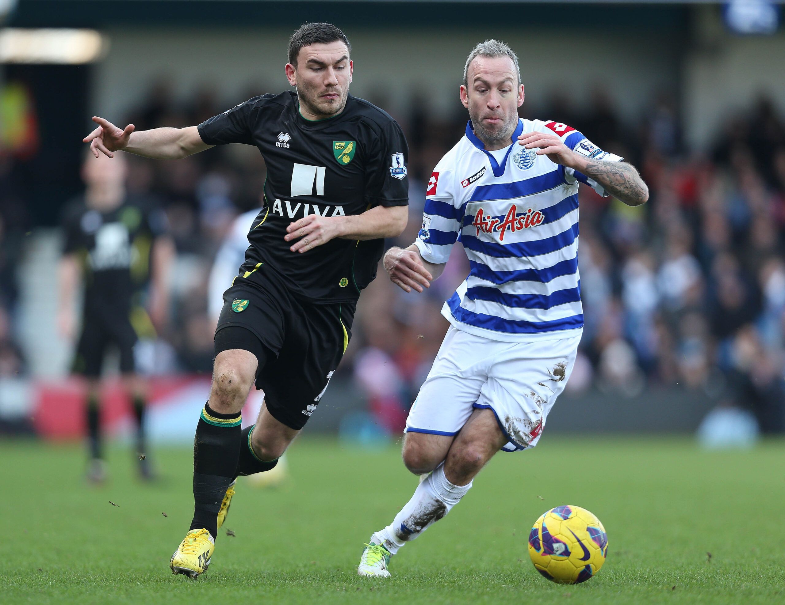 Football - Queens Park Rangers v Norwich City - Barclays Premier League  - Loftus Road - 2/2/13 
QPR's Shaun Derry (R) and Norwich's Robert Snodgrass in action 
Mandatory Credit: Action Images / Matthew Childs 
Livepic 
EDITORIAL USE ONLY. No use with unauthorized audio, video, data, fixture lists, club/league logos or live services. Online in-match use limited to 45 images, no video emulation. No use in betting, games or single club/league/player publications.  Please contact your account repre