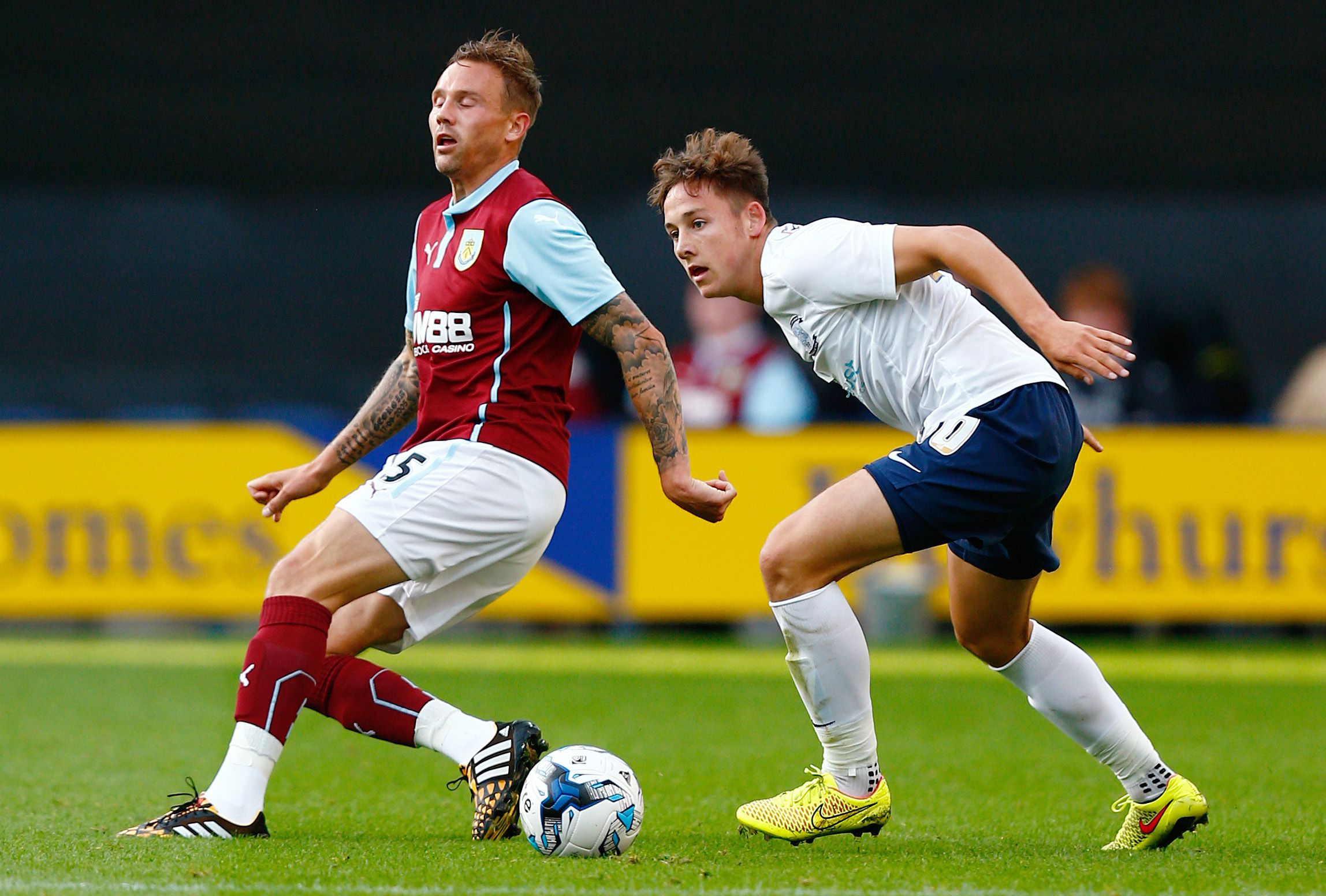 Football - Preston North End v Burnley - Pre Season Friendly - Deepdale - 29/7/14 
Preston North End's Josh Brownhill (R) in action with Burnley's Matt Taylor 
Mandatory Credit: Action Images / Jason Cairnduff 
Livepic 
EDITORIAL USE ONLY.