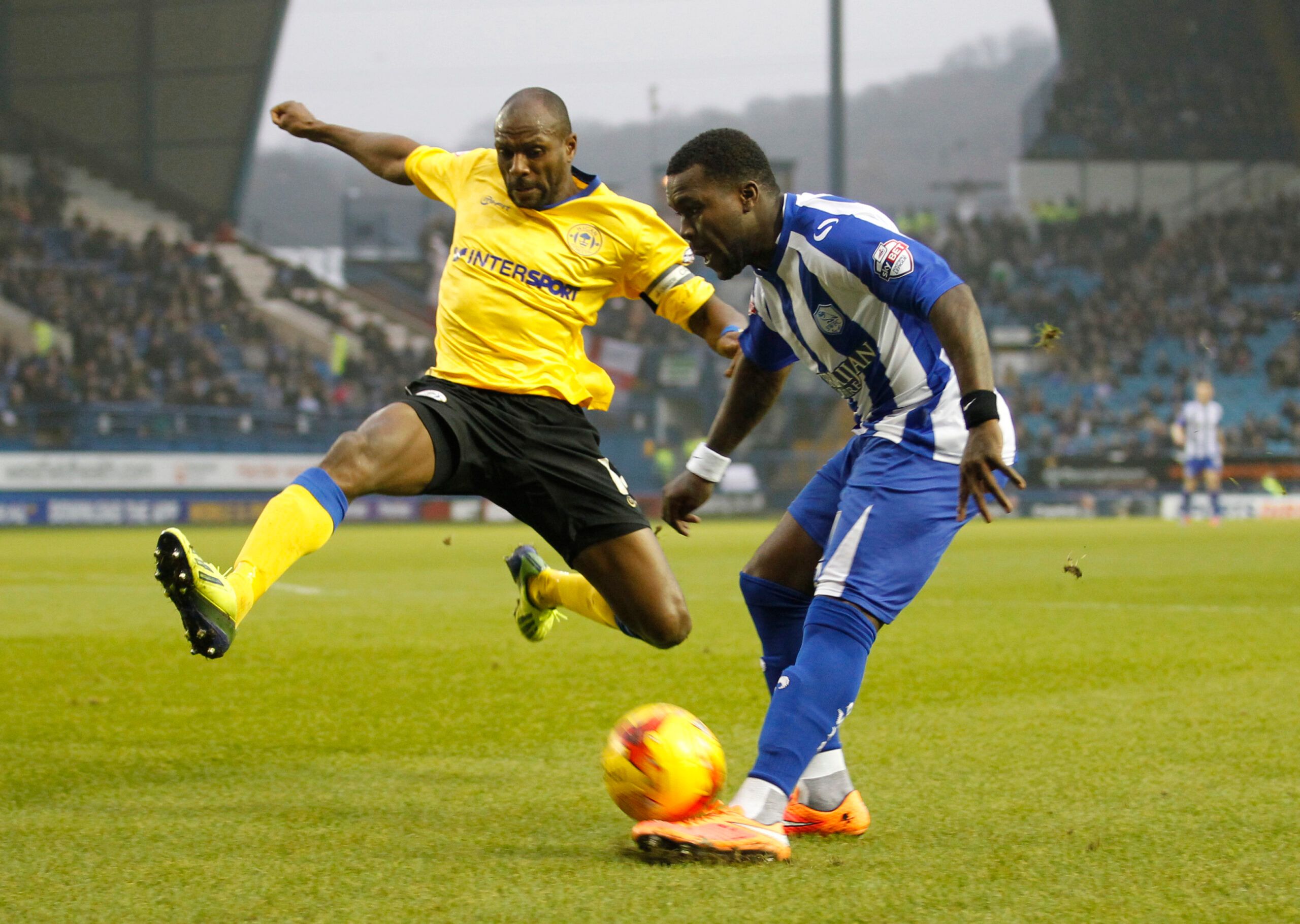 Football - Sheffield Wednesday v Wigan Athletic - Sky Bet Football League Championship - Hillsborough - 14/15 - 29/11/14 
Wigan's Emmerson Boyce in action against Sheffield Wednesday's Royston Drenthe  
Mandatory Credit: Action Images / John Clifton 
EDITORIAL USE ONLY. No use with unauthorized audio, video, data, fixture lists, club/league logos or 