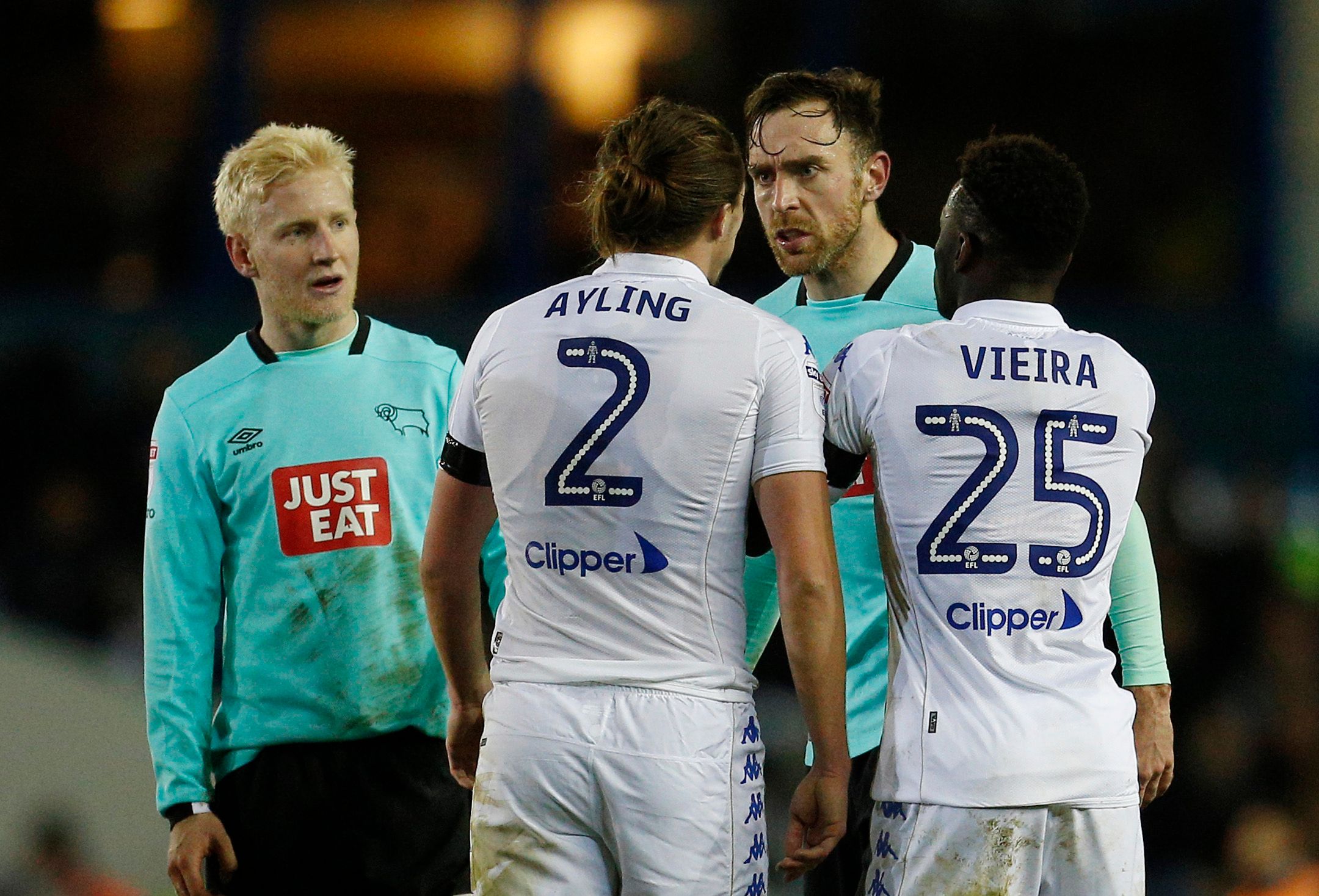Britain Football Soccer - Leeds United v Derby County - Sky Bet Championship - Elland Road - 13/1/17 Leeds' Luke Ayling clashes with Derby's Richard Keogh as Will Hughes and Leeds' Ronaldo Vieira look on Mandatory Credit: Action Images / Craig Brough Livepic EDITORIAL USE ONLY. No use with unauthorized audio, video, data, fixture lists, club/league logos or 