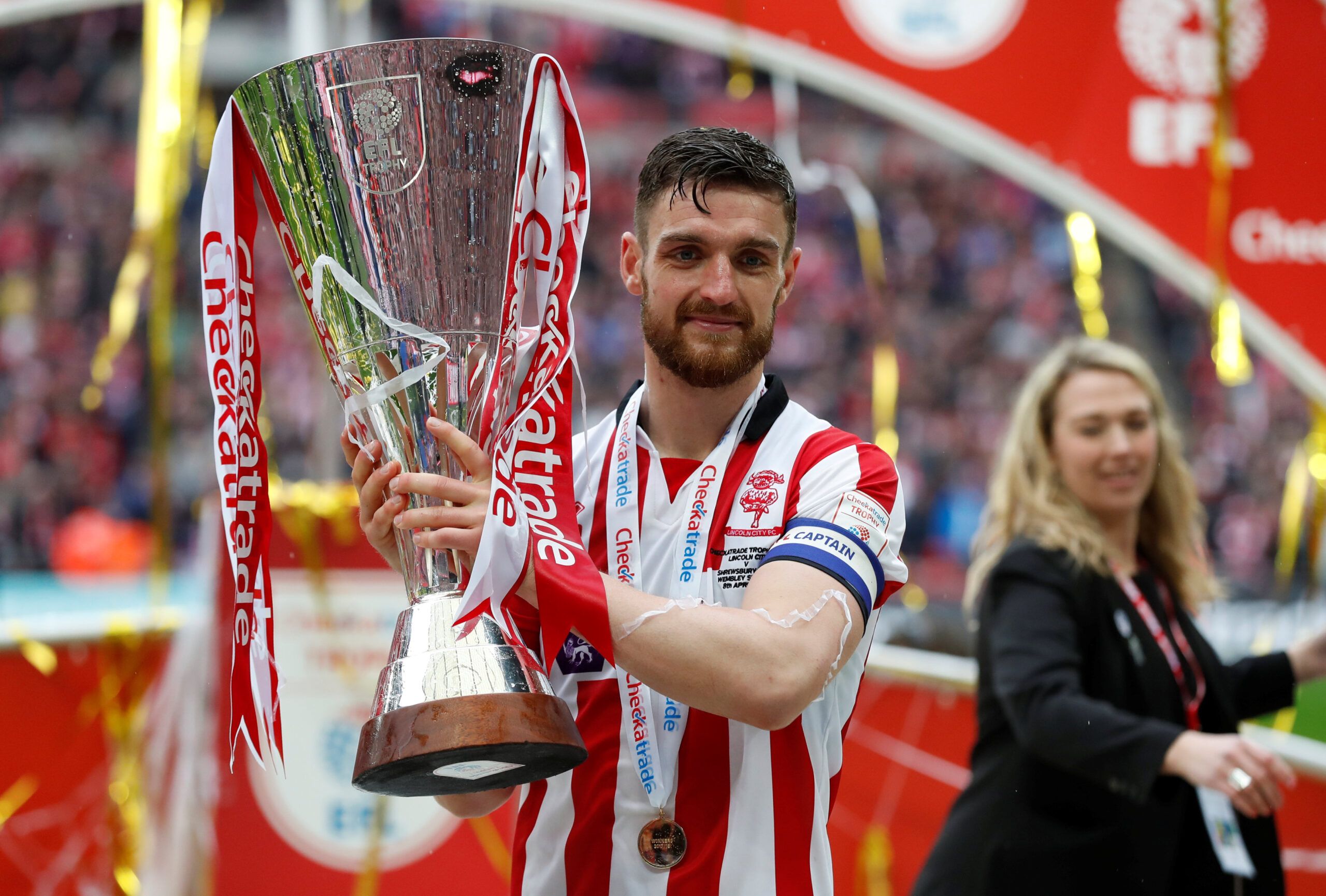Soccer Football - Checkatrade Trophy Final - Lincoln City vs Shrewsbury Town - Wembley Stadium, London, Britain - April 8, 2018  Lincoln CityÕs Luke Waterfall celebrates with the trophy after winning the Checkatrade Trophy Final  Action Images/Matthew Childs  EDITORIAL USE ONLY. No use with unauthorized audio, video, data, fixture lists, club/league logos or 