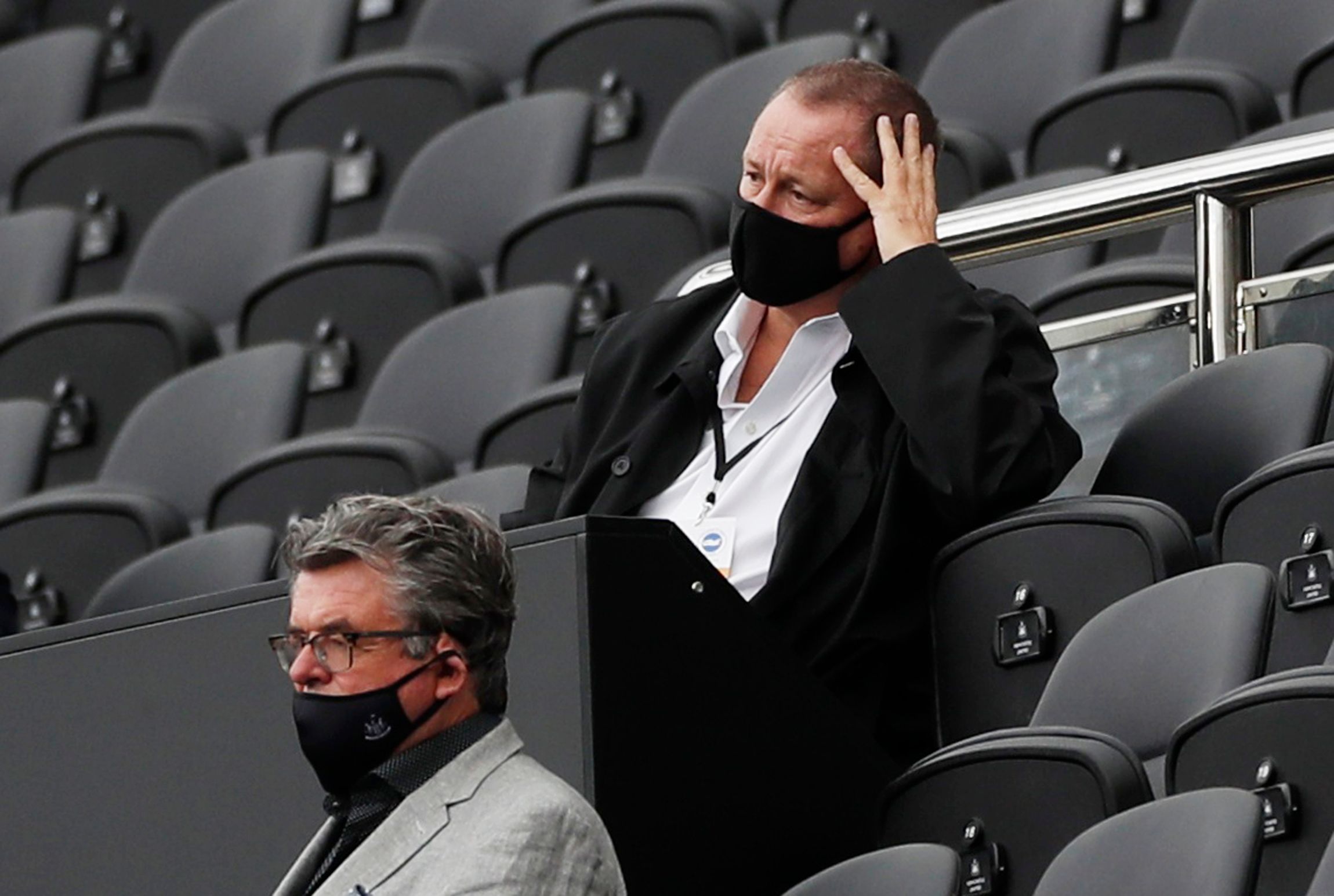 Soccer Football - Premier League - Newcastle United v Brighton &amp; Hove Albion - St James' Park, Newcastle, Britain - September 20, 2020 Newcastle United owner Mike Ashley wearing a protective face mask in the stands Pool via REUTERS/Lee Smith EDITORIAL USE ONLY. No use with unauthorized audio, video, data, fixture lists, club/league logos or 'live' services. Online in-match use limited to 75 images, no video emulation. No use in betting, games or single club/league/player publications.  Pleas
