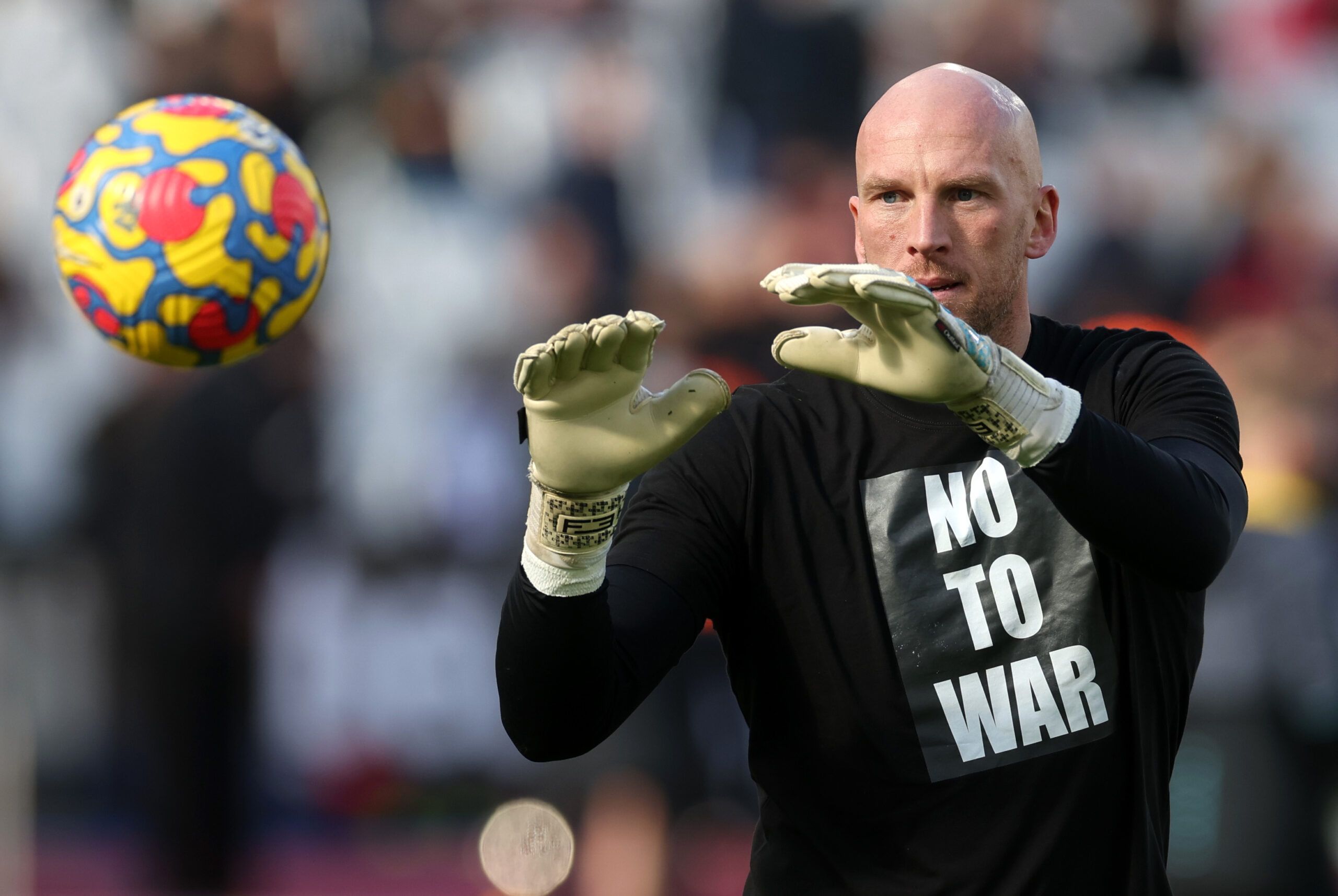 Soccer Football - Premier League - West Ham United v Wolverhampton Wanderers - London Stadium, London, Britain - February 27, 2022  Wolverhampton Wanderers' John Ruddy wears a no to war shirt in support of Ukraine during the warm up before the match Action Images via Reuters/Paul Childs