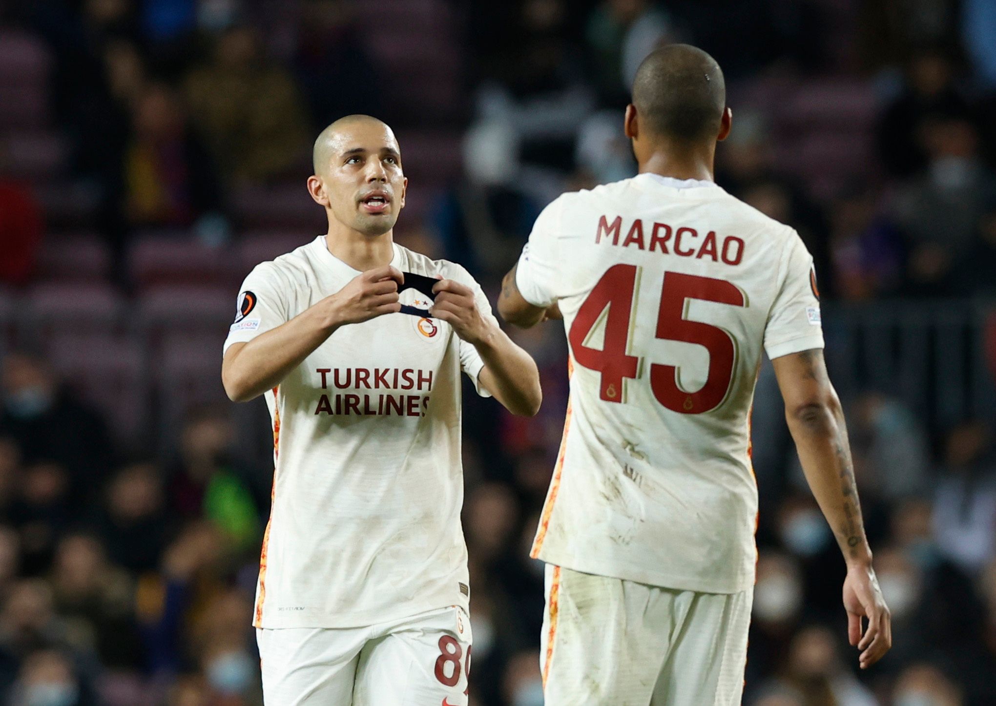 Soccer Football - Europa League - Round of 16 First Leg - FC Barcelona v Galatasaray - Camp Nou, Barcelona, Spain - March 10, 2022 Galatasaray's Sofiane Feghouli and  Marcao during the match REUTERS/Albert Gea