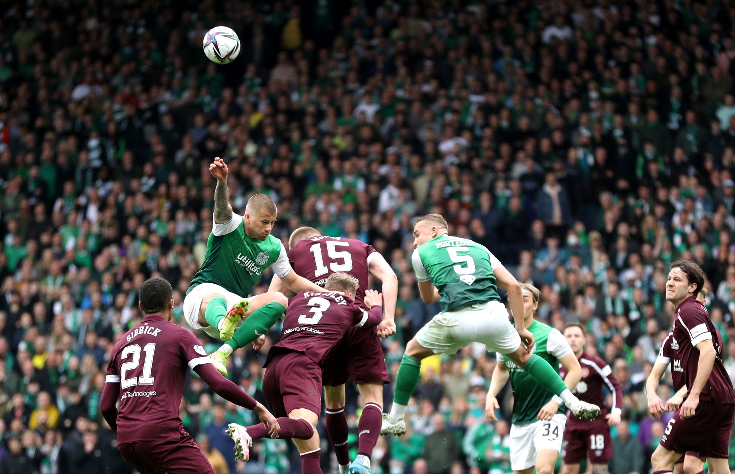 Soccer Football - Scottish Cup Semi-Final - Heart of Midlothian v Hibernian - Hampden Park, Glasgow, Scotland, Britain - April 16, 2022 Hibernian's Harrison Clarke and Ryan Porteous in action with Heart of Midlothian's Taylor Moore and Stephen Kingsley REUTERS/Russell Cheyne