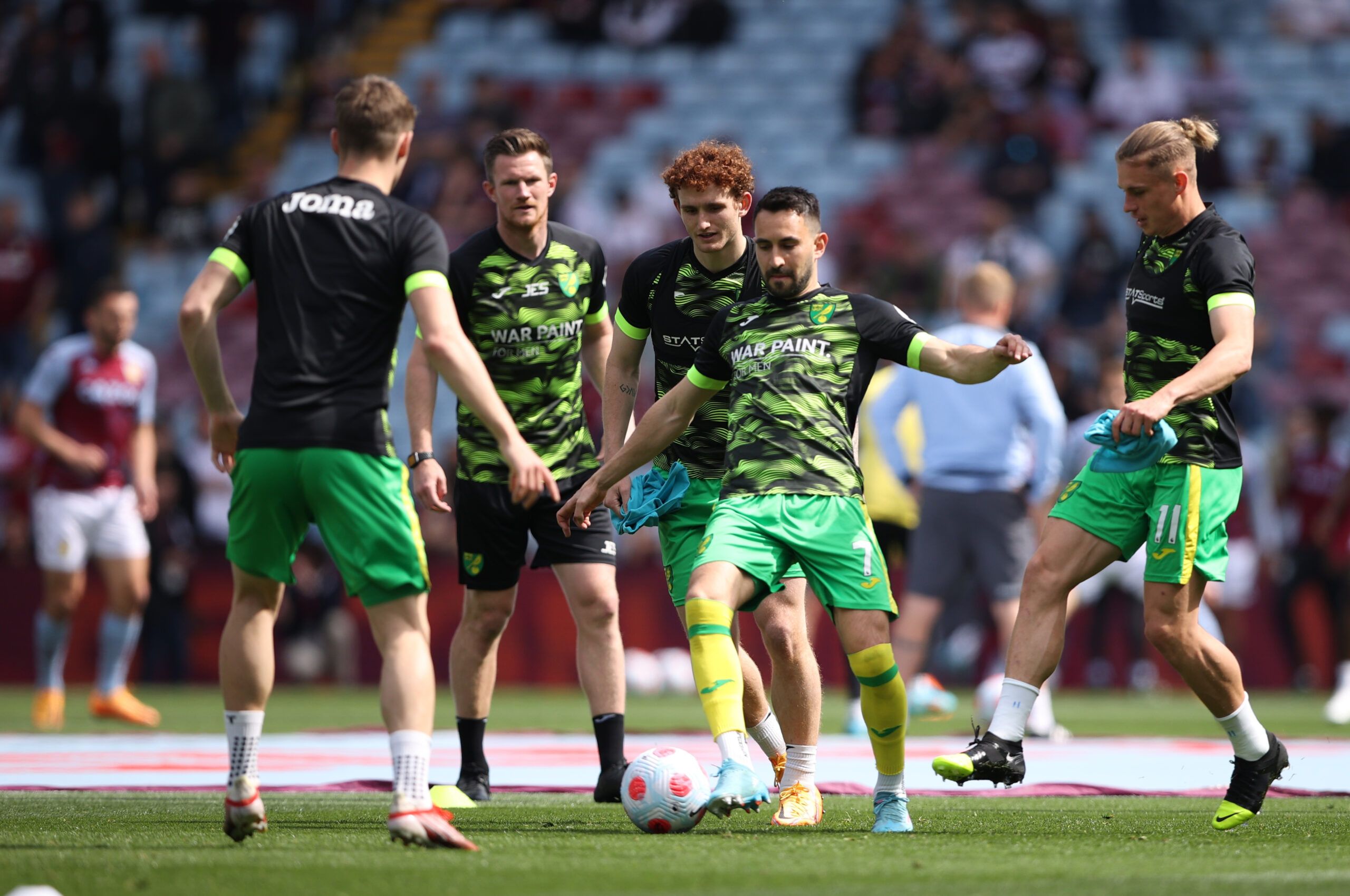 Soccer Football - Premier League - Aston Villa v Norwich City - Villa Park, Birmingham, Britain - April 30, 2022 Norwich City's Lukas Rupp, Przemyslaw Placheta and Josh Sargent with teammates during the warm up before the match Action Images via Reuters/Molly Darlington EDITORIAL USE ONLY. No use with unauthorized audio, video, data, fixture lists, club/league logos or 'live' services. Online in-match use limited to 75 images, no video emulation. No use in betting, games or single club /league/p