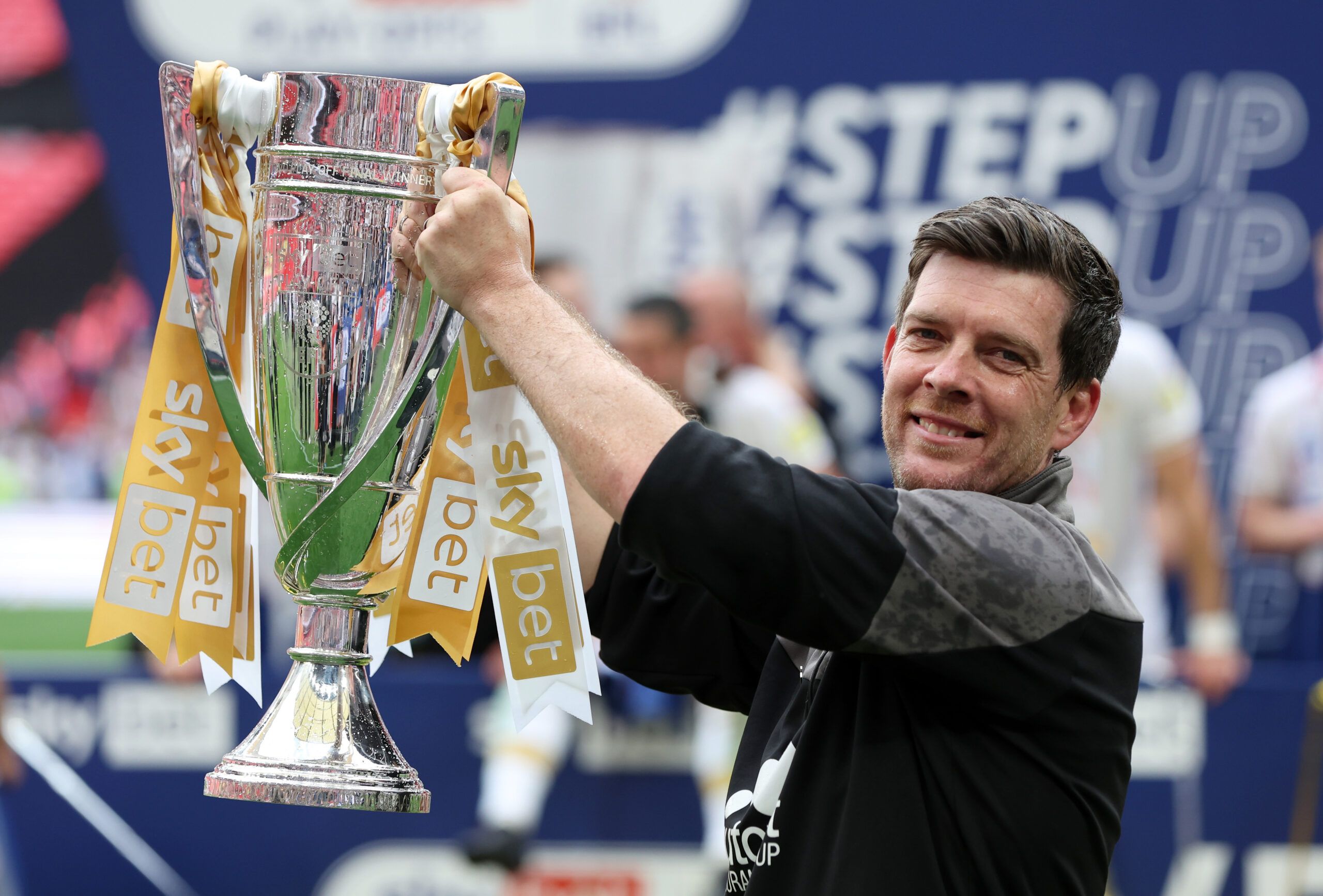 Soccer Football - League Two Play-Off Final - Mansfield Town v Port Vale - Wembley Stadium, London, Britain - May 28, 2022  Port Vale manager Darrell Clarke lifts the trophy after winning the League Two Play-Off Action Images/Paul Childs EDITORIAL USE ONLY. No use with unauthorized audio, video, data, fixture lists, club/league logos or 'live' services. Online in-match use limited to 75 images, no video emulation. No use in betting, games or single club /league/player publications.  Please conta