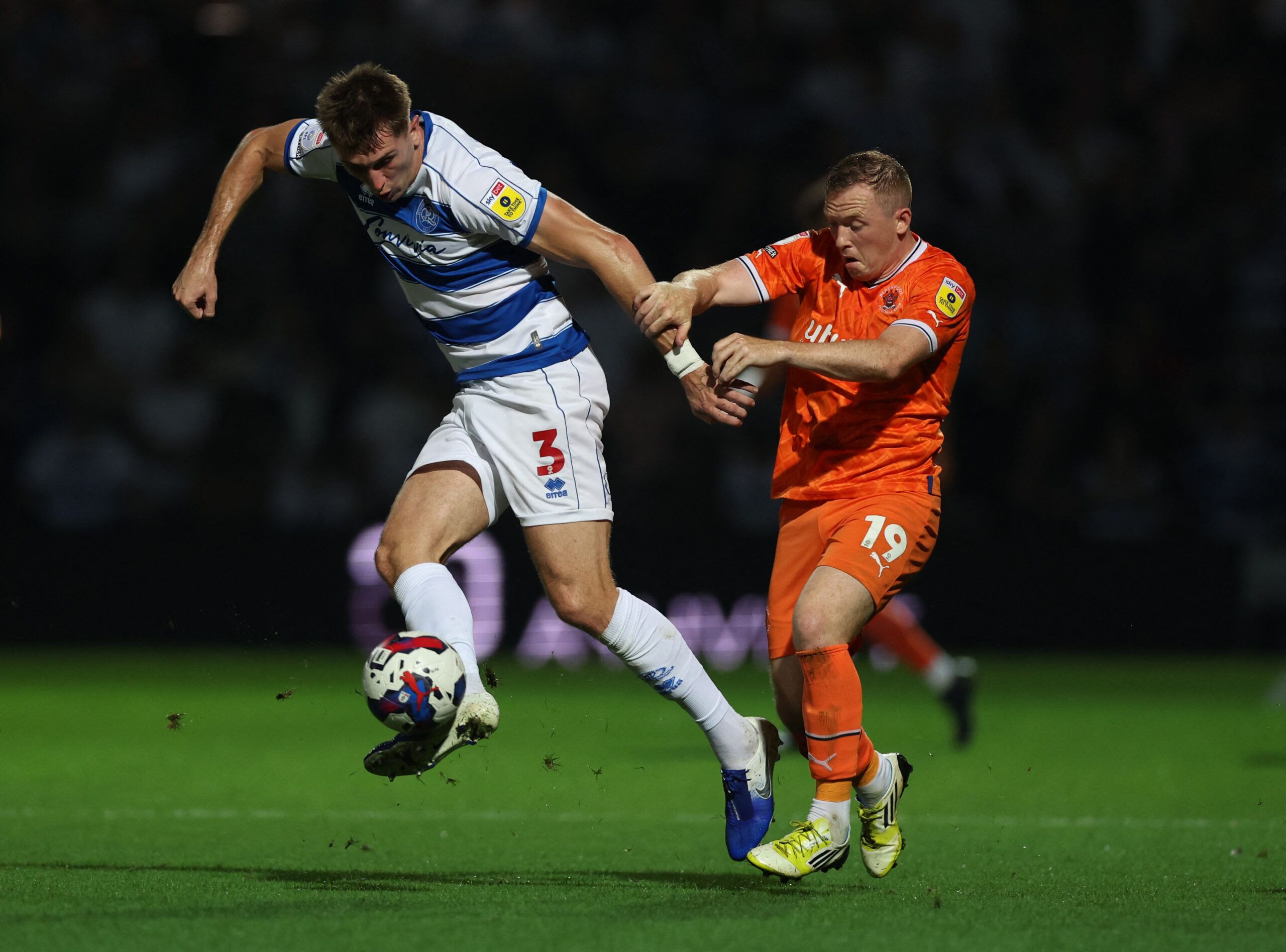 Soccer Football - Championship - Queens Park Rangers v Blackpool - Loftus Road, London, Britain - August 16, 2022 Queens Park Rangers' Jimmy Dunne in action with Blackpool's Shayne Lavery Action Images/Matthew Childs EDITORIAL USE ONLY. No use with unauthorized audio, video, data, fixture lists, club/league logos or 'live' services. Online in-match use limited to 75 images, no video emulation. No use in betting, games or single club /league/player publications.  Please contact your account repre