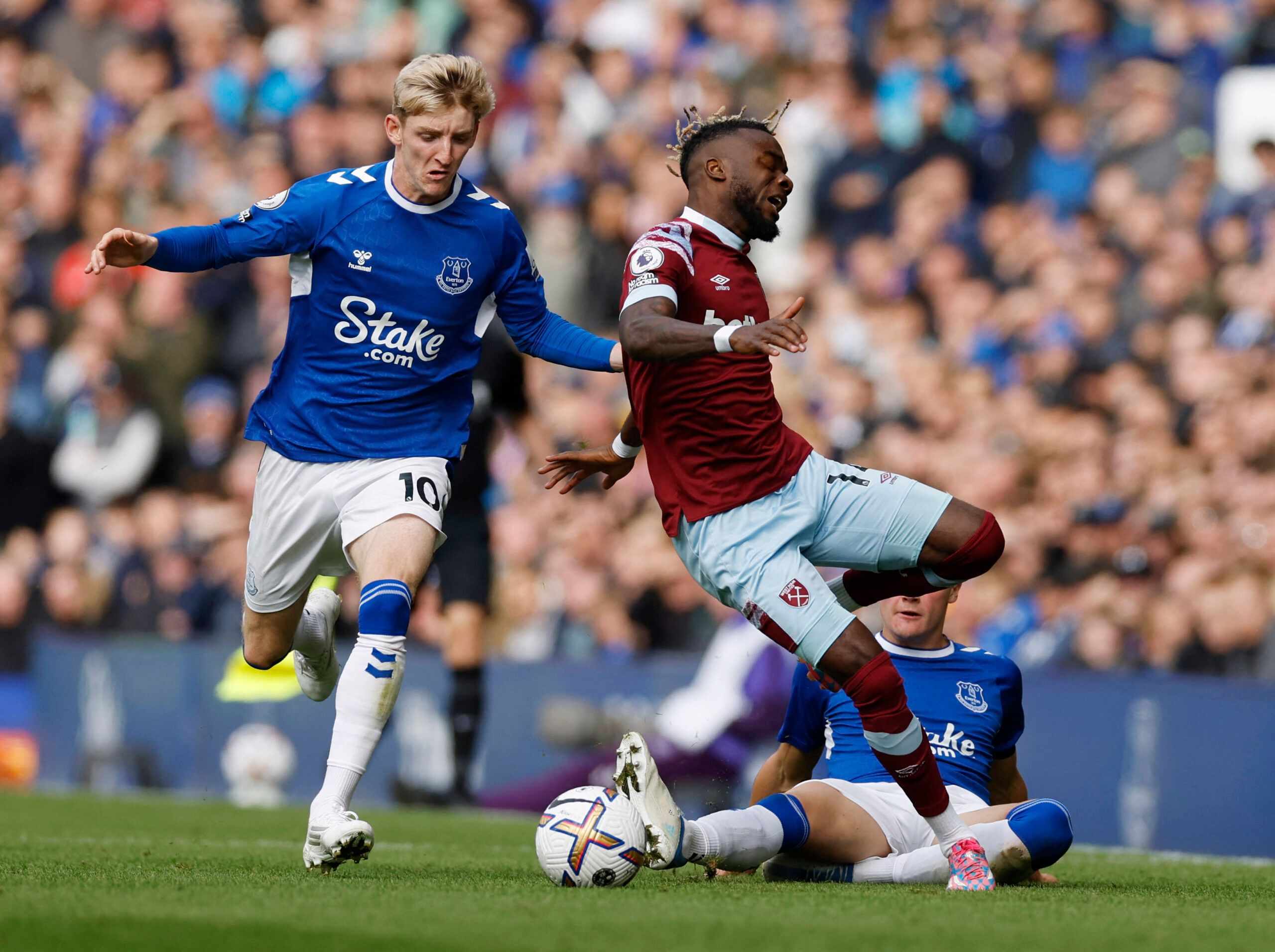 Soccer Football - Premier League - Everton v West Ham United - Goodison Park, Liverpool, Britain - September 18, 2022 Everton's Anthony Gordon fouls West Ham United's Maxwel Cornet before receiving a yellow card Action Images via Reuters/Jason Cairnduff EDITORIAL USE ONLY. No use with unauthorized audio, video, data, fixture lists, club/league logos or 'live' services. Online in-match use limited to 75 images, no video emulation. No use in betting, games or single club /league/player publication