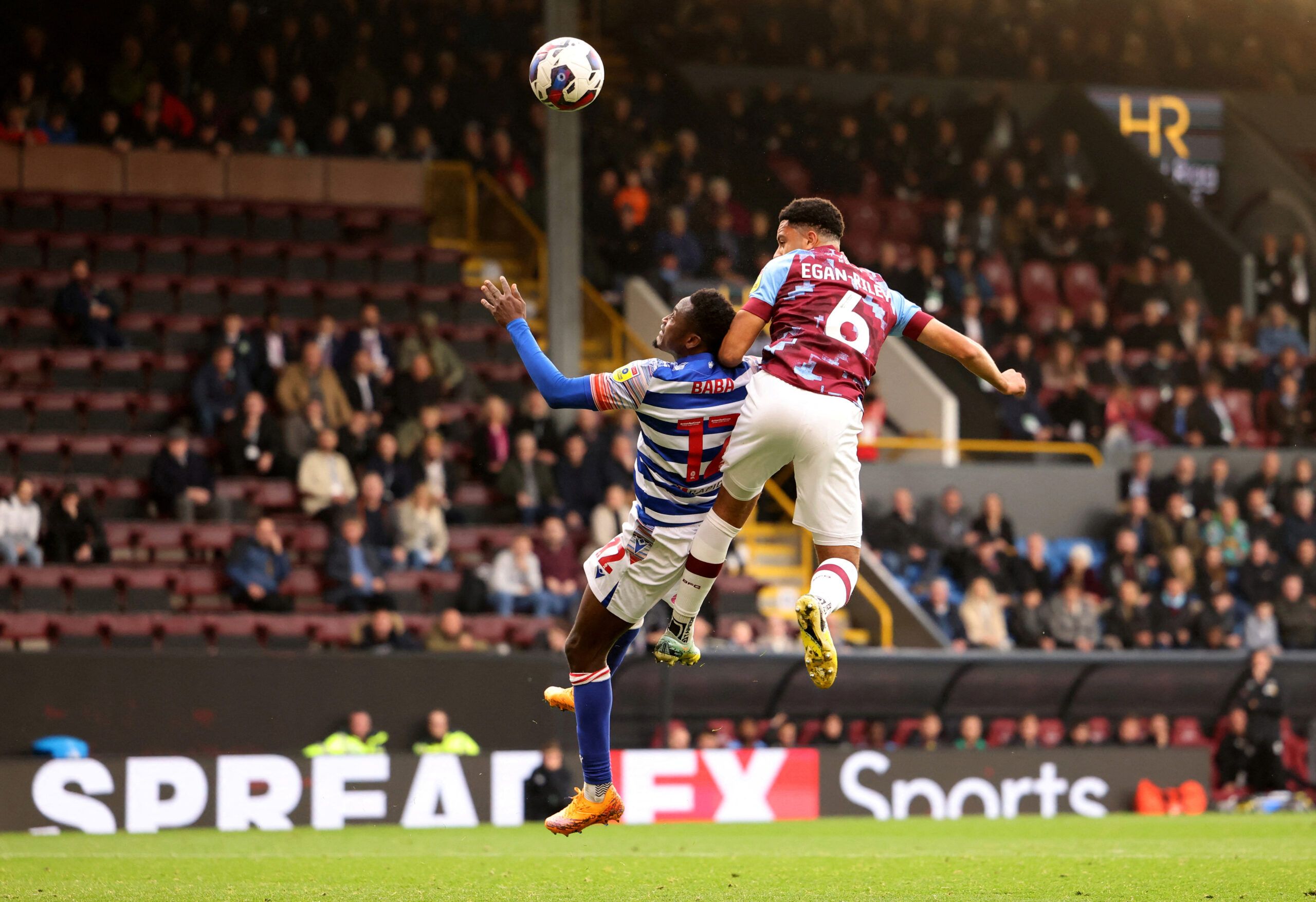 Soccer Football - Championship - Burnley v Reading - Turf Moor, Burnley, Britain - October 29, 2022 Burnley's CJ Egan-Riley in action with Reading's Baba Rahman Action Images/John Clifton   EDITORIAL USE ONLY. No use with unauthorized audio, video, data, fixture lists, club/league logos or 