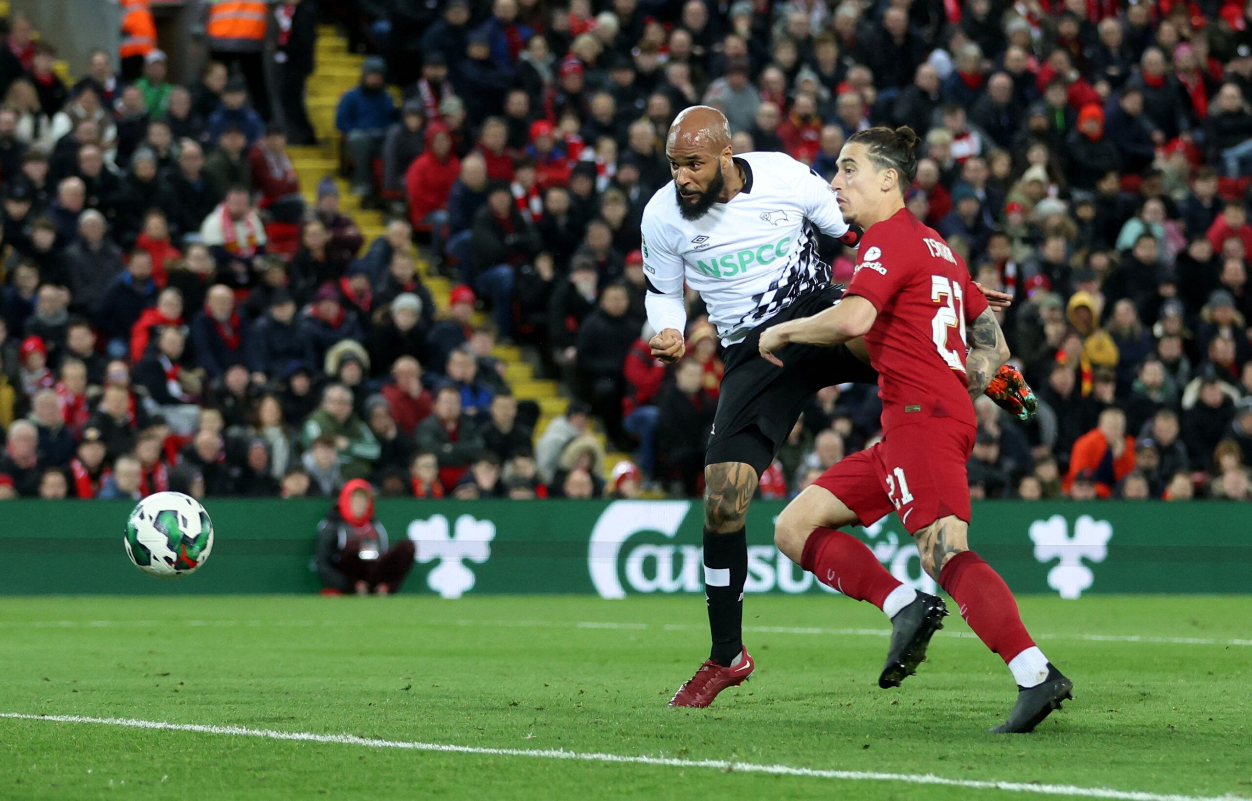 Soccer Football - Carabao Cup Third Round - Liverpool v Derby County - Anfield, Liverpool, Britain - November 9, 2022 Derby County's David McGoldrick in action with Liverpool's Kostas Tsimikas REUTERS/Carl Recine EDITORIAL USE ONLY. No use with unauthorized audio, video, data, fixture lists, club/league logos or 'live' services. Online in-match use limited to 75 images, no video emulation. No use in betting, games or single club /league/player publications.  Please contact your account represent