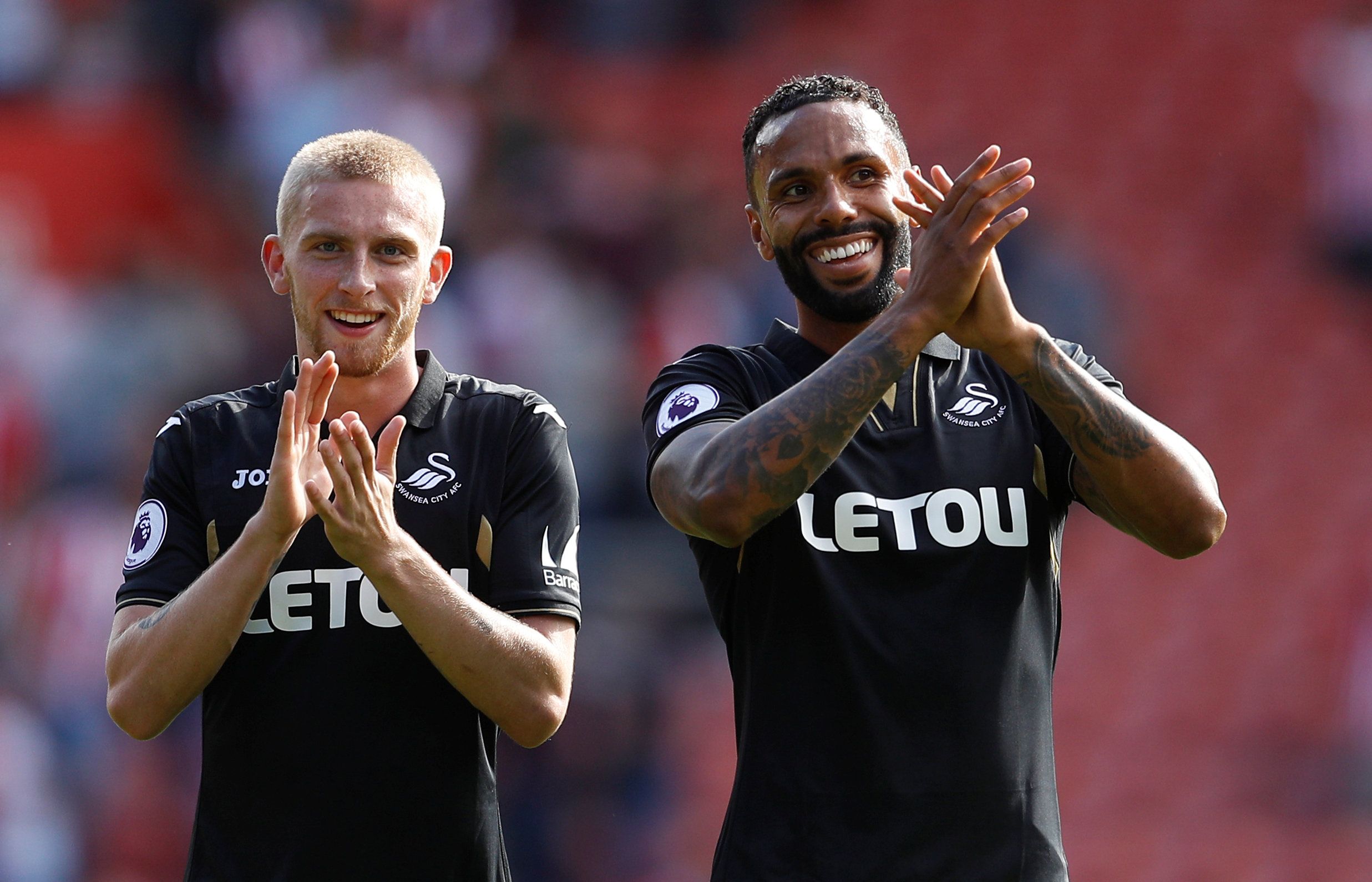 Football Soccer - Premier League - Southampton vs Swansea City - Southampton, Britain - August 12, 2017   Swansea City's Oliver McBurnie and Kyle Bartley applaud fan after the match   REUTERS/Peter Nicholls  EDITORIAL USE ONLY. No use with unauthorized audio, video, data, fixture lists, club/league logos or 