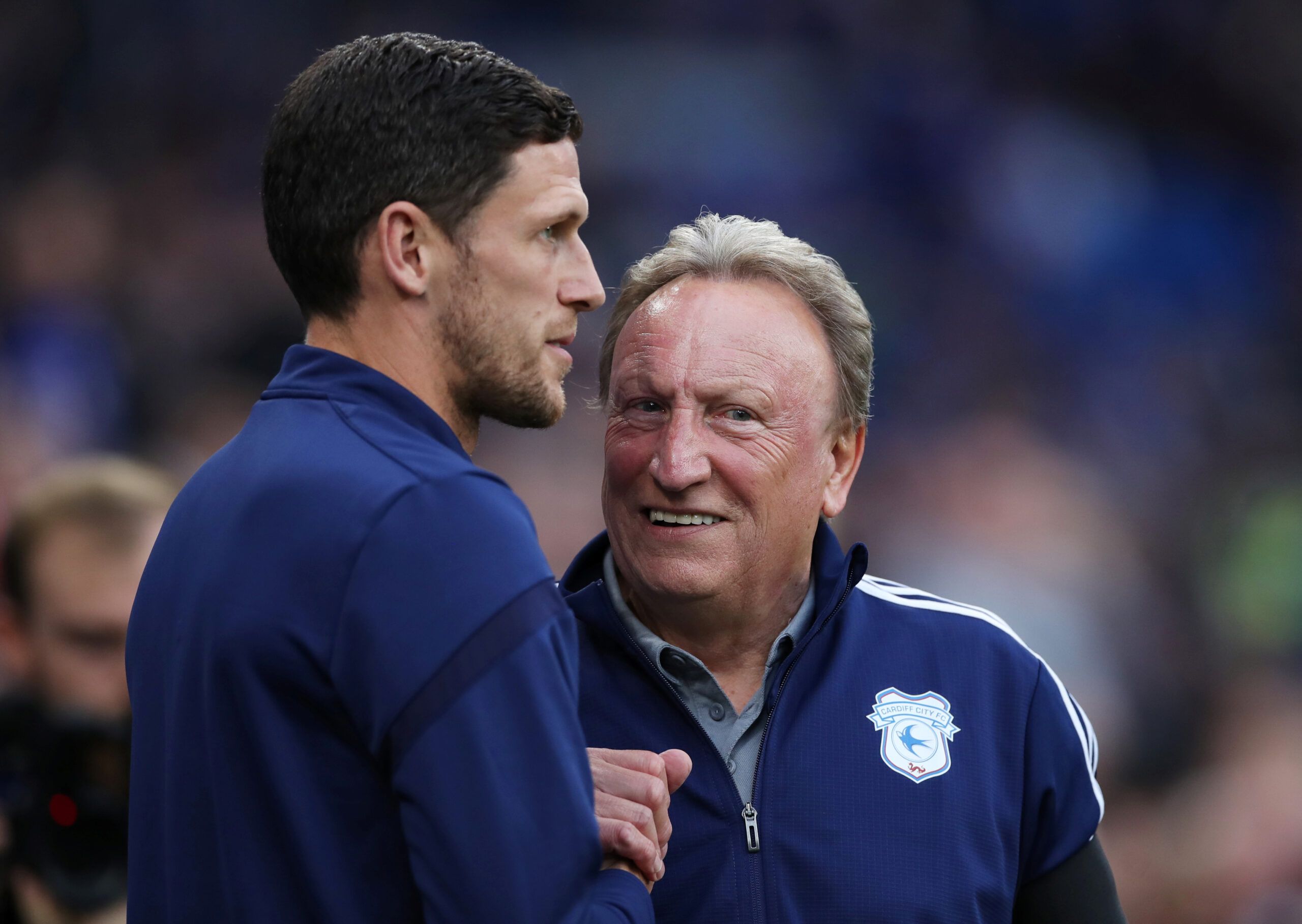 Soccer Football - Championship - Cardiff City v Huddersfield Town - Cardiff City Stadium, Cardiff, Britain - August 21, 2019   Huddersfield Town caretaker manager Mark Hudson and Cardiff City manager Neil Warnock before the match   Action Images/Peter Cziborra    EDITORIAL USE ONLY. No use with unauthorized audio, video, data, fixture lists, club/league logos or 