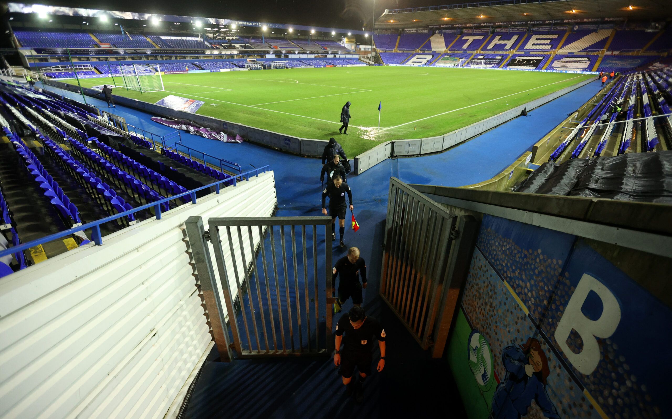 Soccer Football - Championship - Birmingham City v Preston North End - St Andrew's, Birmingham, Britain - January 20, 2021 Match officials leave the pitch at the end of the game Action Images/Carl Recine EDITORIAL USE ONLY. No use with unauthorized audio, video, data, fixture lists, club/league logos or 'live' services. Online in-match use limited to 75 images, no video emulation. No use in betting, games or single club /league/player publications.  Please contact your account representative for