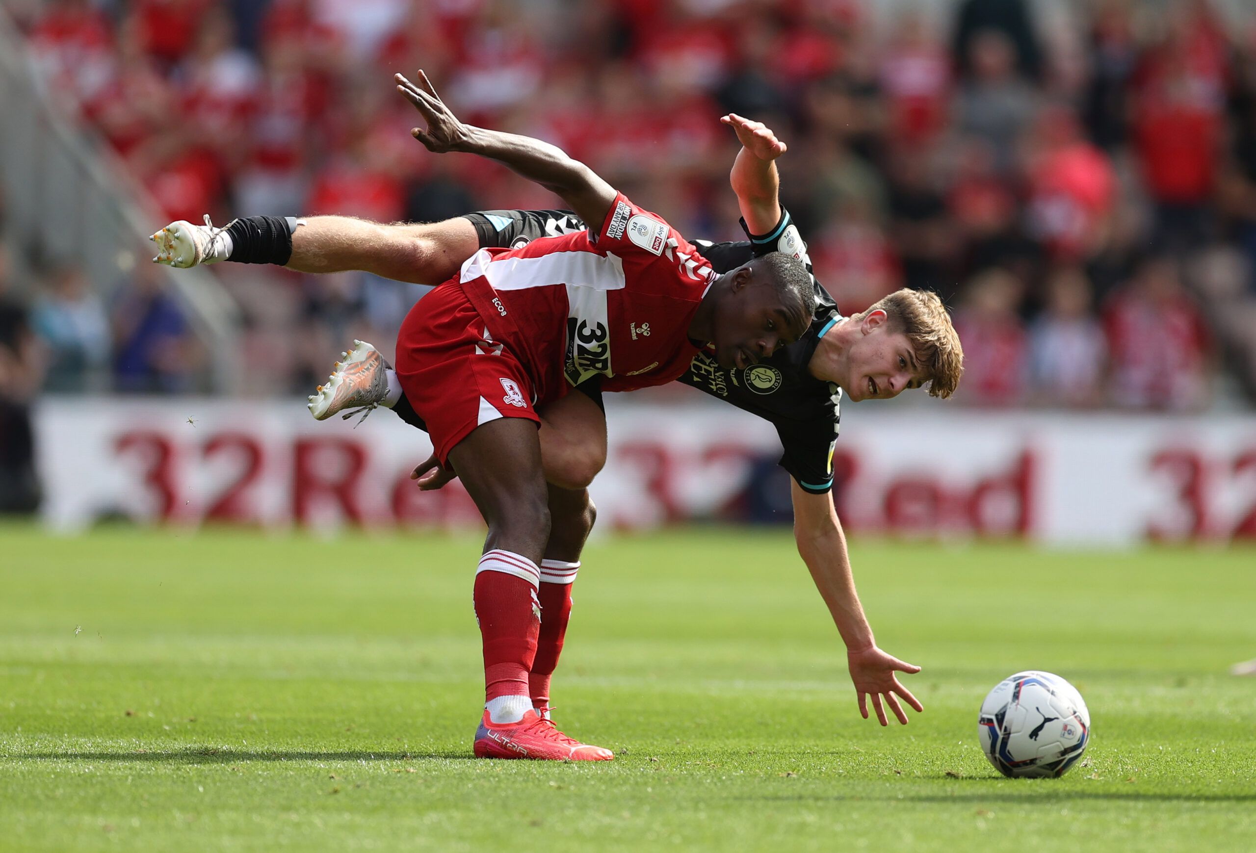 Soccer Football - Championship - Middlesbrough v Bristol City - Riverside Stadium, Middlesbrough, Britain - August 14, 2021 Middlesbrough's Marc Bola in action with Bristol City's Alex Scott Action Images/Lee Smith EDITORIAL USE ONLY. No use with unauthorized audio, video, data, fixture lists, club/league logos or 'live' services. Online in-match use limited to 75 images, no video emulation. No use in betting, games or single club /league/player publications.  Please contact your account represe