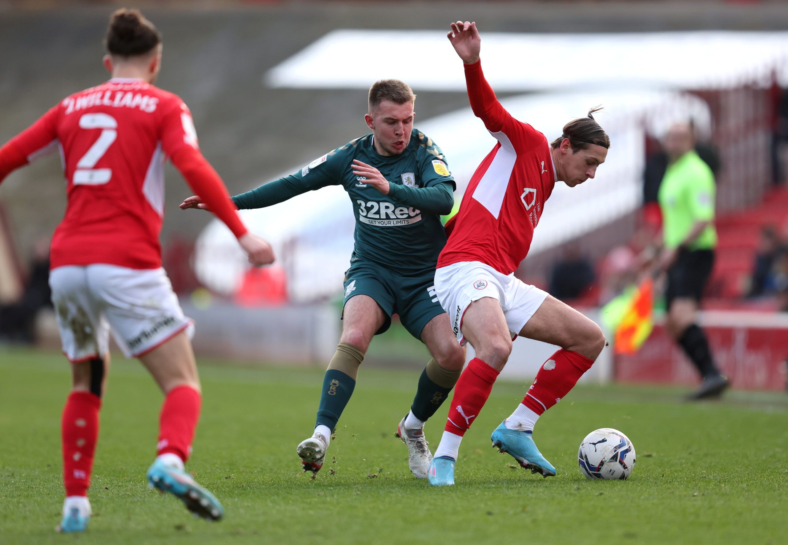 Soccer Football -  Championship - Barnsley v Middlesbrough - Oakwell, Barnsley, Britain - February 26, 2022 Barnsley's Callum Brittain in action with Middlesbrough's Caolan Boyd-Munce  Action Images/John Clifton  EDITORIAL USE ONLY. No use with unauthorized audio, video, data, fixture lists, club/league logos or 