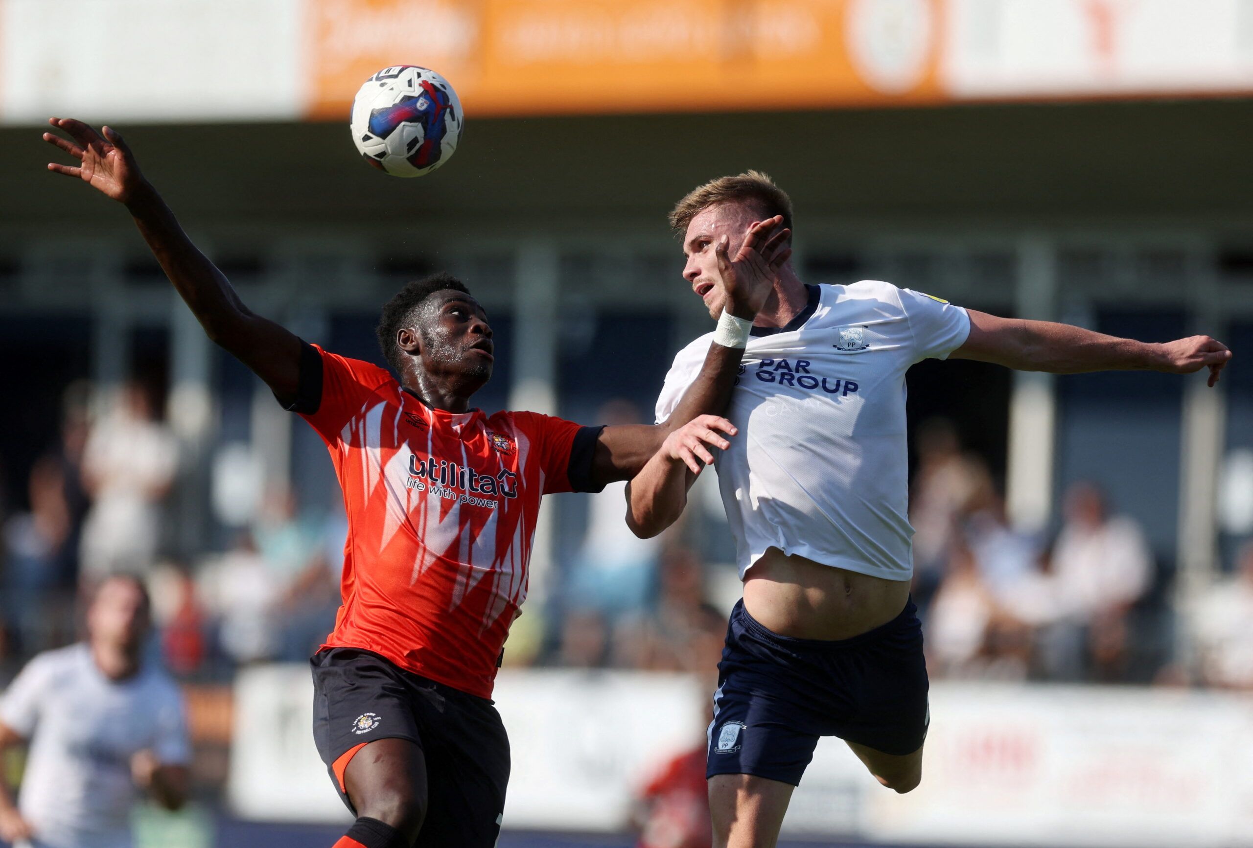 Soccer Football - Championship - Luton Town v Preston North End - Kenilworth Road, Luton, Britain - August 13, 2022 Luton Town's Elijah Adebayo in action with Preston North End's Liam Lindsay  Action Images/Paul Childs  EDITORIAL USE ONLY. No use with unauthorized audio, video, data, fixture lists, club/league logos or 