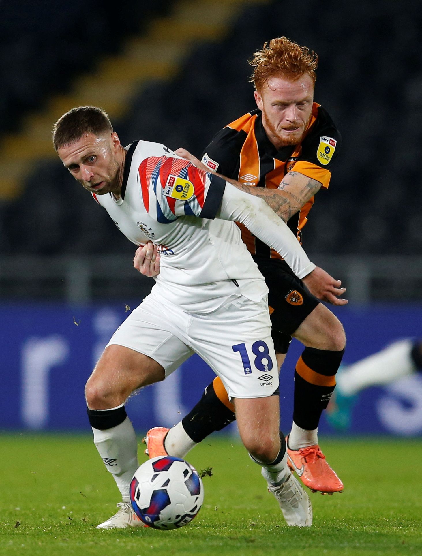Soccer Football - Championship - Hull City v Luton Town - MKM Stadium, Hull, Britain - September 30, 2022 Luton Town's Jordan Clark in action with Hull City's Ryan Woods  Action Images/Ed Sykes  EDITORIAL USE ONLY. No use with unauthorized audio, video, data, fixture lists, club/league logos or 
