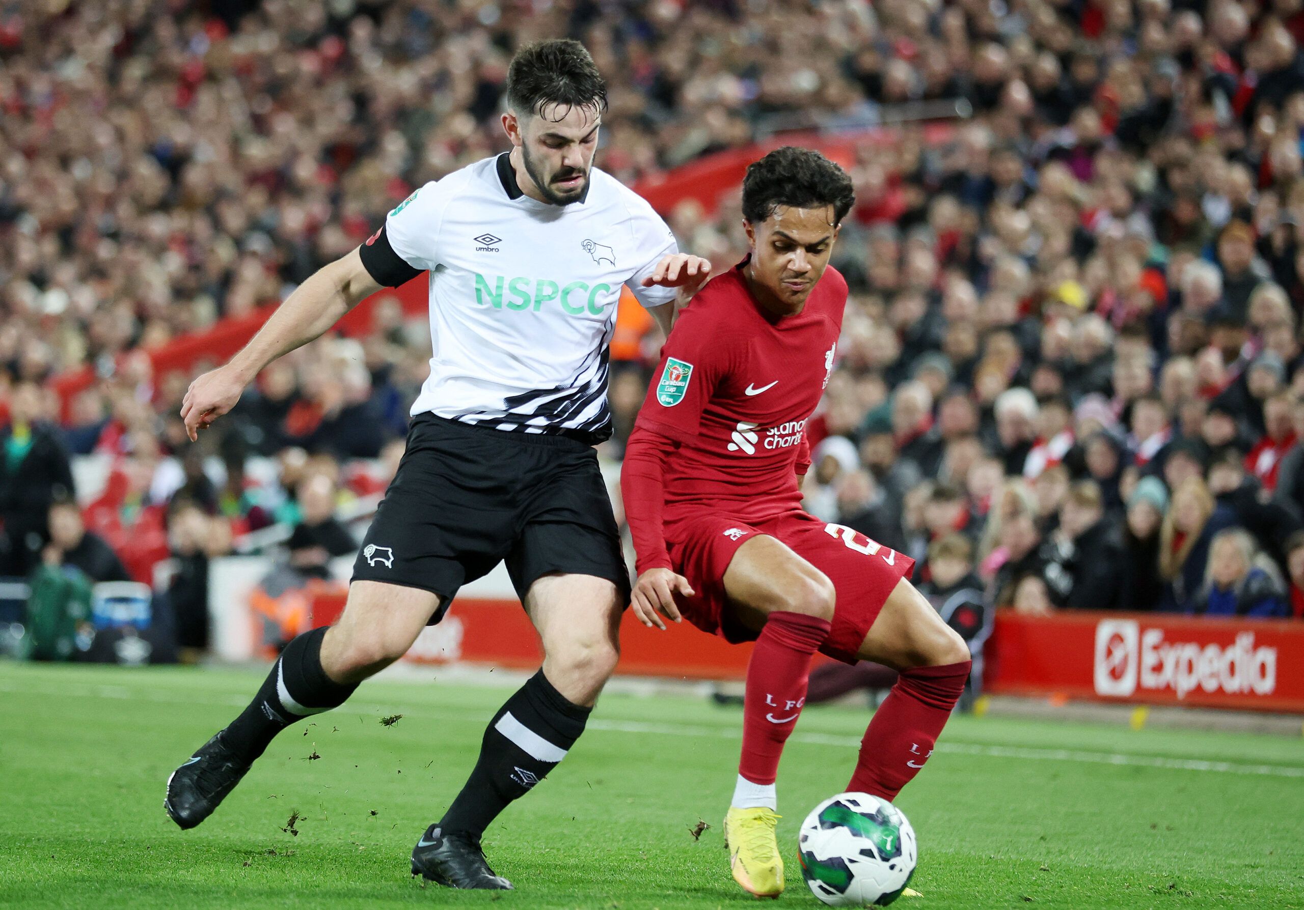 Soccer Football - Carabao Cup Third Round - Liverpool v Derby County - Anfield, Liverpool, Britain - November 9, 2022 Liverpool's Fabio Carvalho in action with Derby County's Eiran Cashin REUTERS/Carl Recine EDITORIAL USE ONLY. No use with unauthorized audio, video, data, fixture lists, club/league logos or 'live' services. Online in-match use limited to 75 images, no video emulation. No use in betting, games or single club /league/player publications.  Please contact your account representative