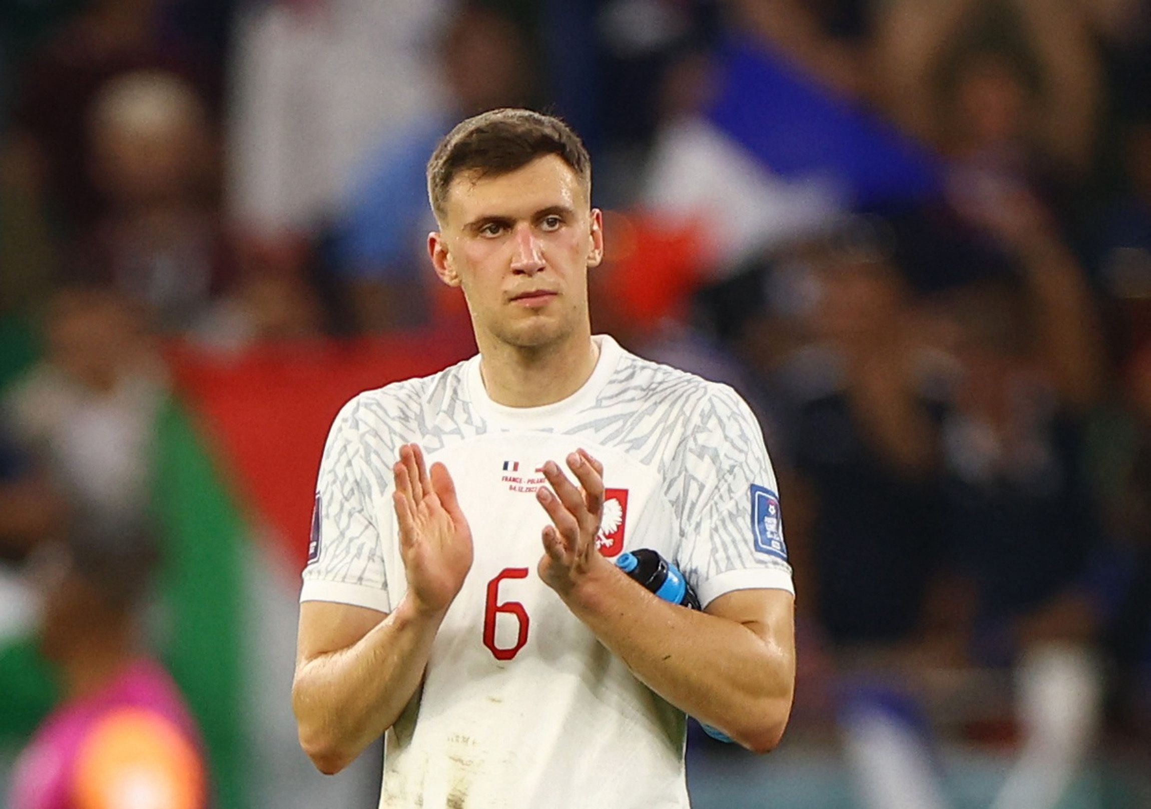 Soccer Football - FIFA World Cup Qatar 2022 - Round of 16 - France v Poland - Al Thumama Stadium, Doha, Qatar - December 4, 2022 Poland's Krystian Bielik applauds fans after the match as Poland are eliminated from the World Cup REUTERS/Hannah Mckay