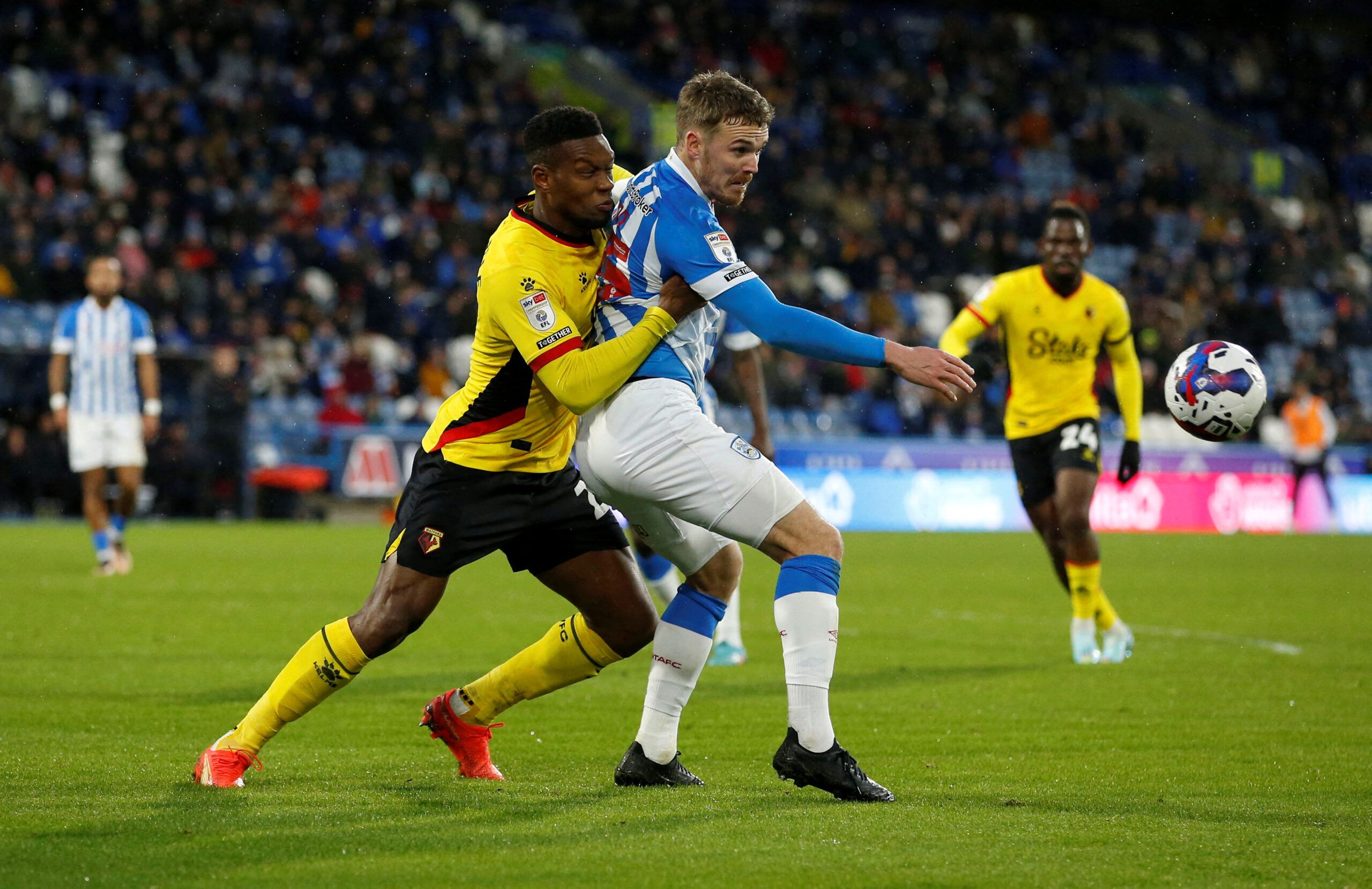 Soccer Football - Championship - Huddersfield Town v Watford - John Smith's Stadium, Huddersfield, Britain - December 17, 2022 Watford's Jeremy Ngakia in action with Huddersfield Town's Danny Ward  Action Images/Ed Sykes  EDITORIAL USE ONLY. No use with unauthorized audio, video, data, fixture lists, club/league logos or 