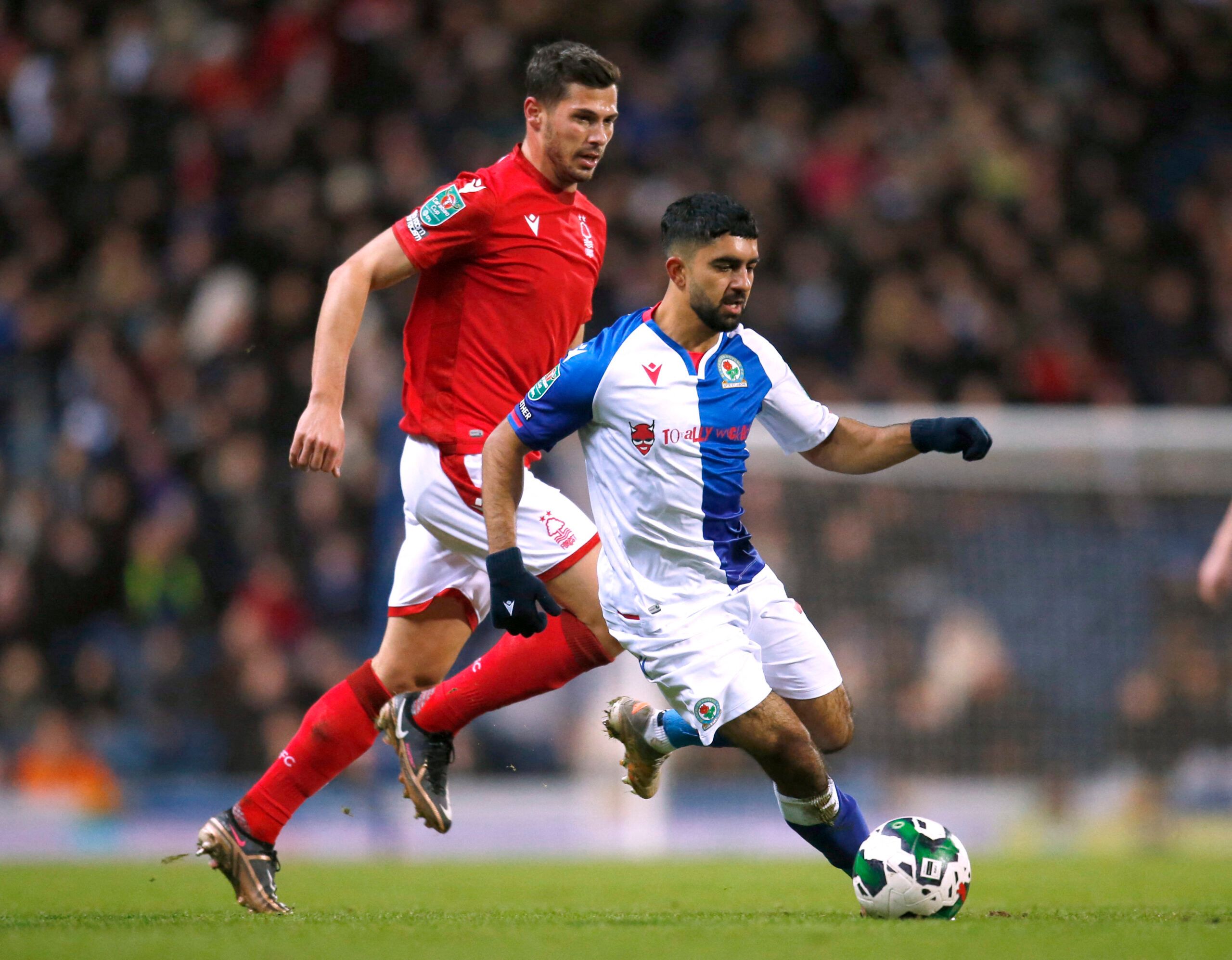 Soccer Football - Carabao Cup - Round of 16 - Blackburn Rovers v Nottingham Forest - Ewood Park, Blackburn, Britain - December 21, 2022 Blackburn Rovers' Dilan Kumar Markanday in action with Nottingham Forest's Remo Freuler Action Images via Reuters/Ed Sykes EDITORIAL USE ONLY. No use with unauthorized audio, video, data, fixture lists, club/league logos or 'live' services. Online in-match use limited to 75 images, no video emulation. No use in betting, games or single club /league/player public