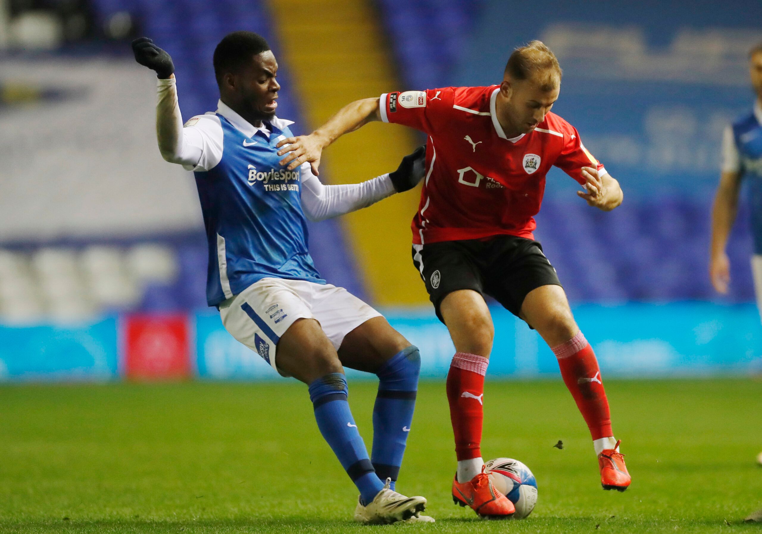 Soccer Football - Championship - Birmingham City v Barnsley - St Andrew's, Birmingham, Britain - December 1, 2020 Birmingham City's Jonathan Leko in action with Barnsley's Herbie Kane Action Images/Matthew Childs EDITORIAL USE ONLY. No use with unauthorized audio, video, data, fixture lists, club/league logos or 'live' services. Online in-match use limited to 75 images, no video emulation. No use in betting, games or single club /league/player publications.  Please contact your account represent