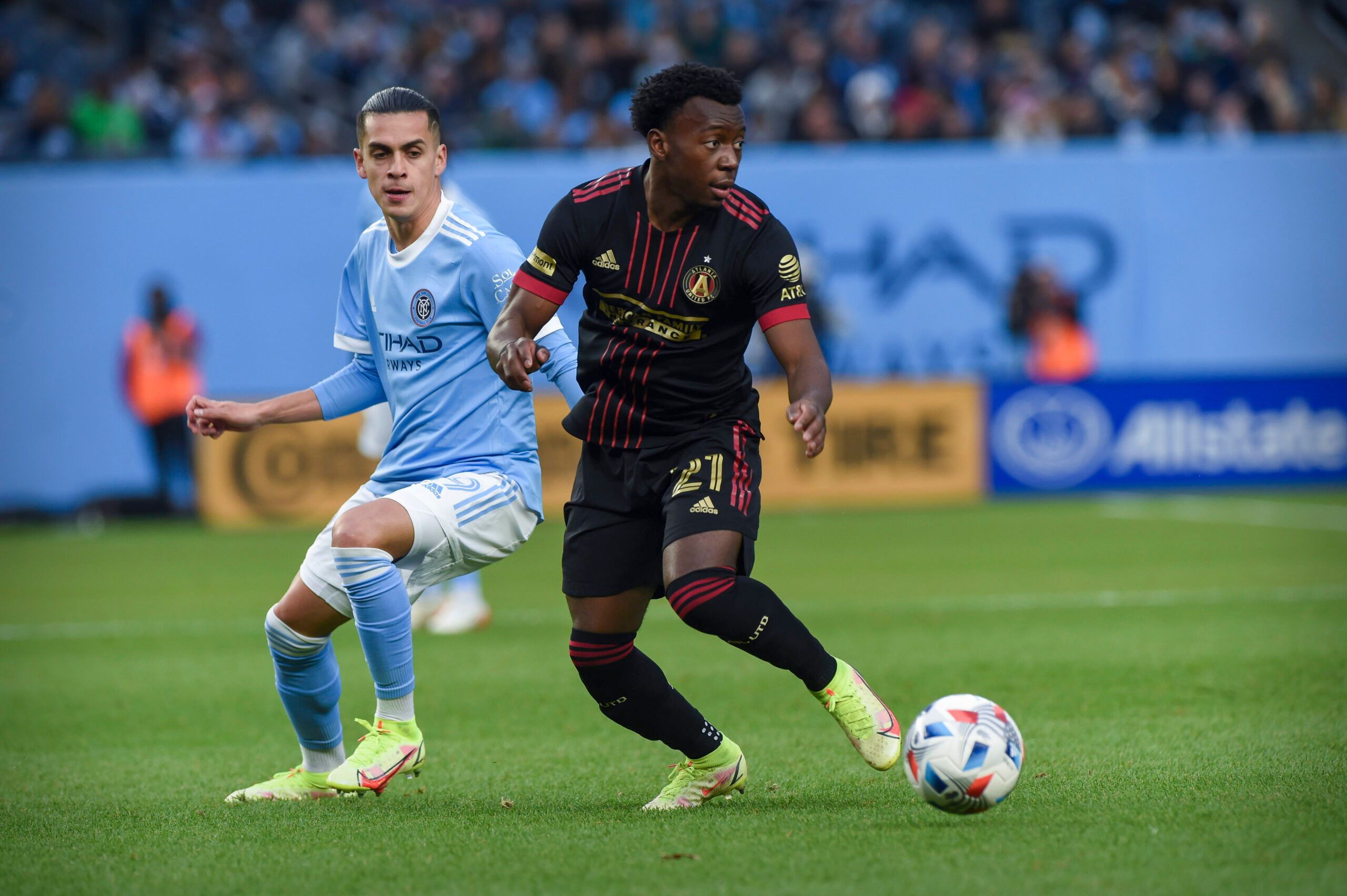 Nov 21, 2021; Bronx, NY, USA; Atlanta United defender George Bello (21) moves the ball past New York City FC forward Heber (9) during the first half in a round one MLS Playoff game at Yankee Stadium. Mandatory Credit: Jonathan Jones-USA TODAY Sports