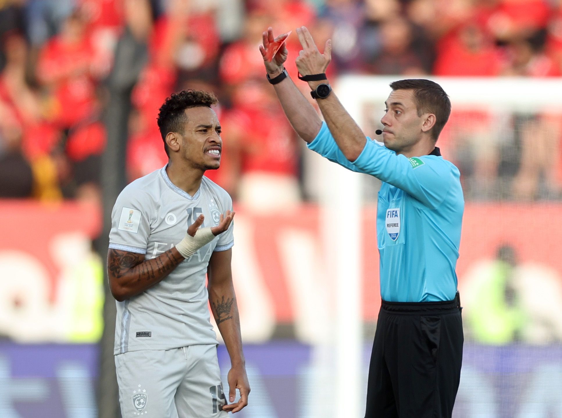 Soccer Football - Club World Cup - Third-Place Playoff - Al Hilal v Al Ahly - Al Nahyan Stadium, Abu Dhabi, United Arab Emirates - February 12, 2022 Al Hilal's Matheus Pereira reacts after he is sent off by referee Clement Turpin REUTERS/Matthew Childs
