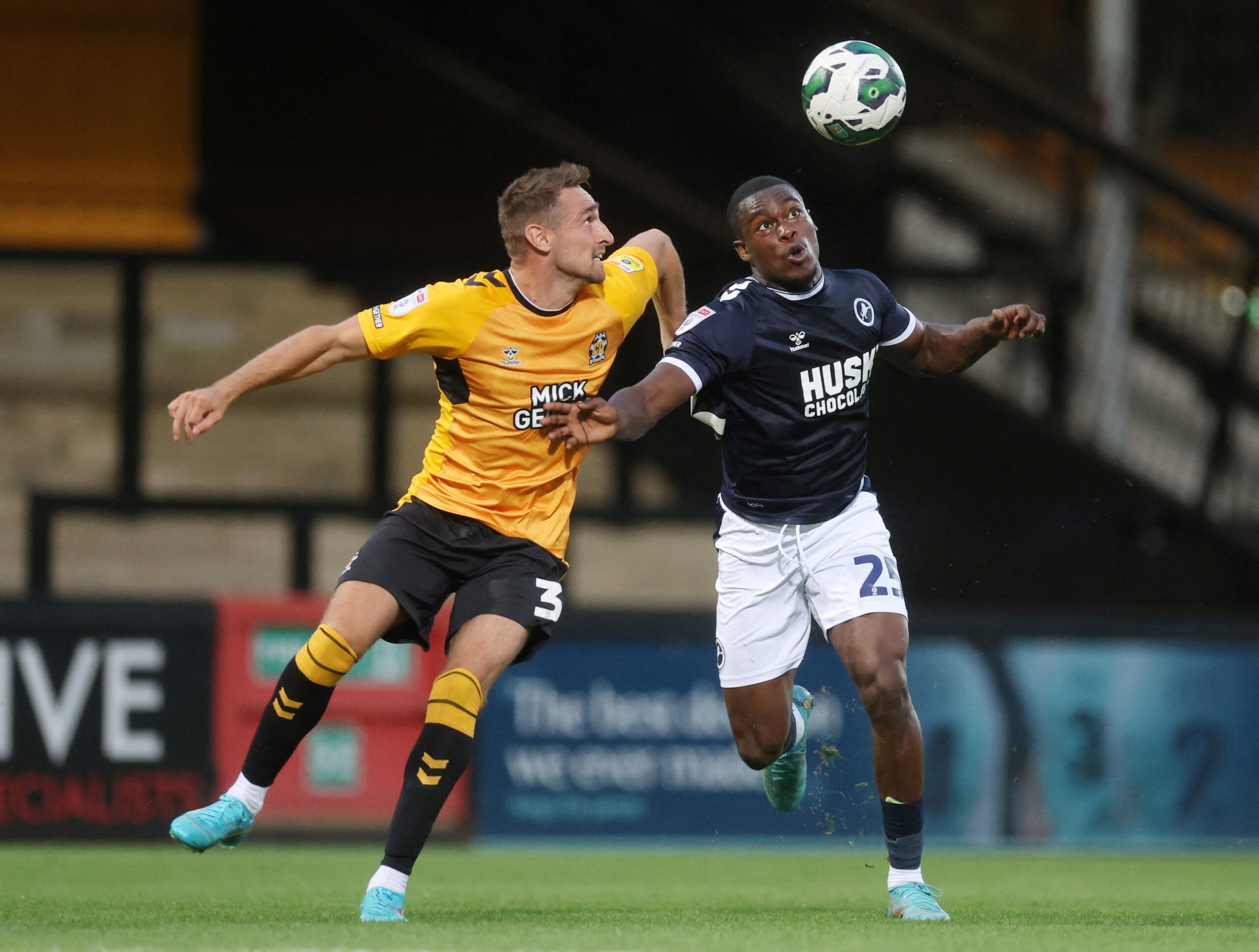 Soccer Football - Carabao Cup - First Round - Cambridge United v Millwall - Abbey Stadium, Cambridge, Britain - August 2, 2022 Cambridge United's Brandon Haunstrup in action with Millwall's Isaac Olaofe  Action Images/Paul Childs  EDITORIAL USE ONLY. No use with unauthorized audio, video, data, fixture lists, club/league logos or 