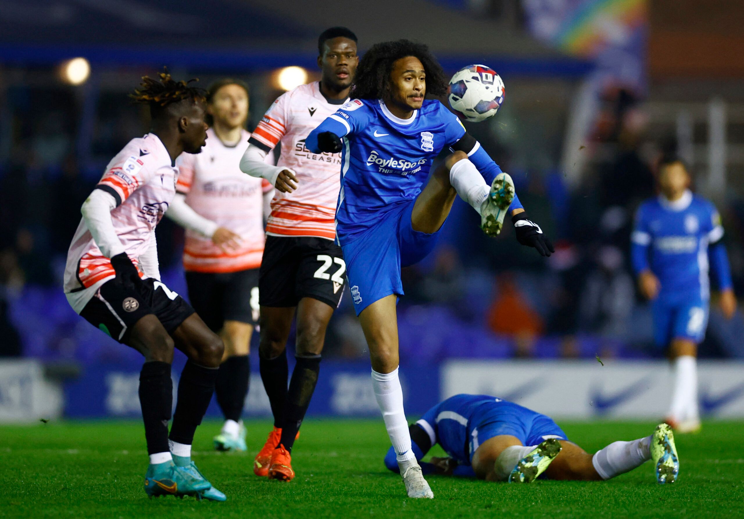 Soccer Football - Championship - Birmingham City v Reading - St Andrews, Birmingham, Britain - December 16, 2022 Birmingham City's Tahith Chong in action with Reading's Amadou Salif Mbengue Action Images/Andrew Boyers EDITORIAL USE ONLY. No use with unauthorized audio, video, data, fixture lists, club/league logos or 'live' services. Online in-match use limited to 75 images, no video emulation. No use in betting, games or single club /league/player publications.  Please contact your account repr