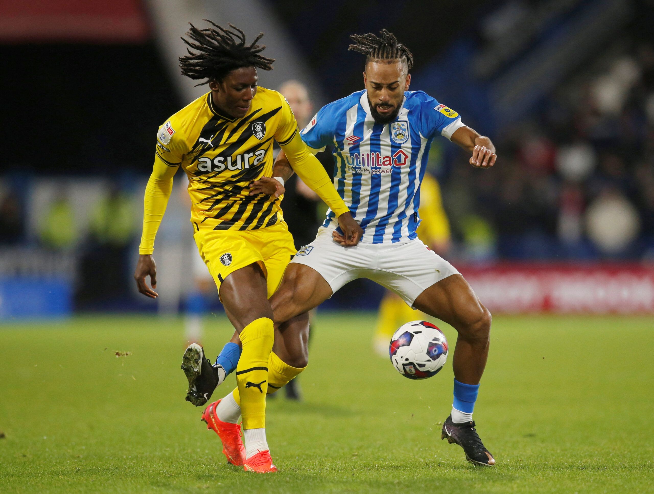 Soccer Football - Championship -  Huddersfield Town v Rotherham United - John Smith's Stadium, Huddersfield, Britain - December 29, 2022  Rotherham United's Brooke Norton-Cuffy in actionwith Huddersfield Town's Sorba Thomas Action Images/Ed Sykes  EDITORIAL USE ONLY. No use with unauthorized audio, video, data, fixture lists, club/league logos or 