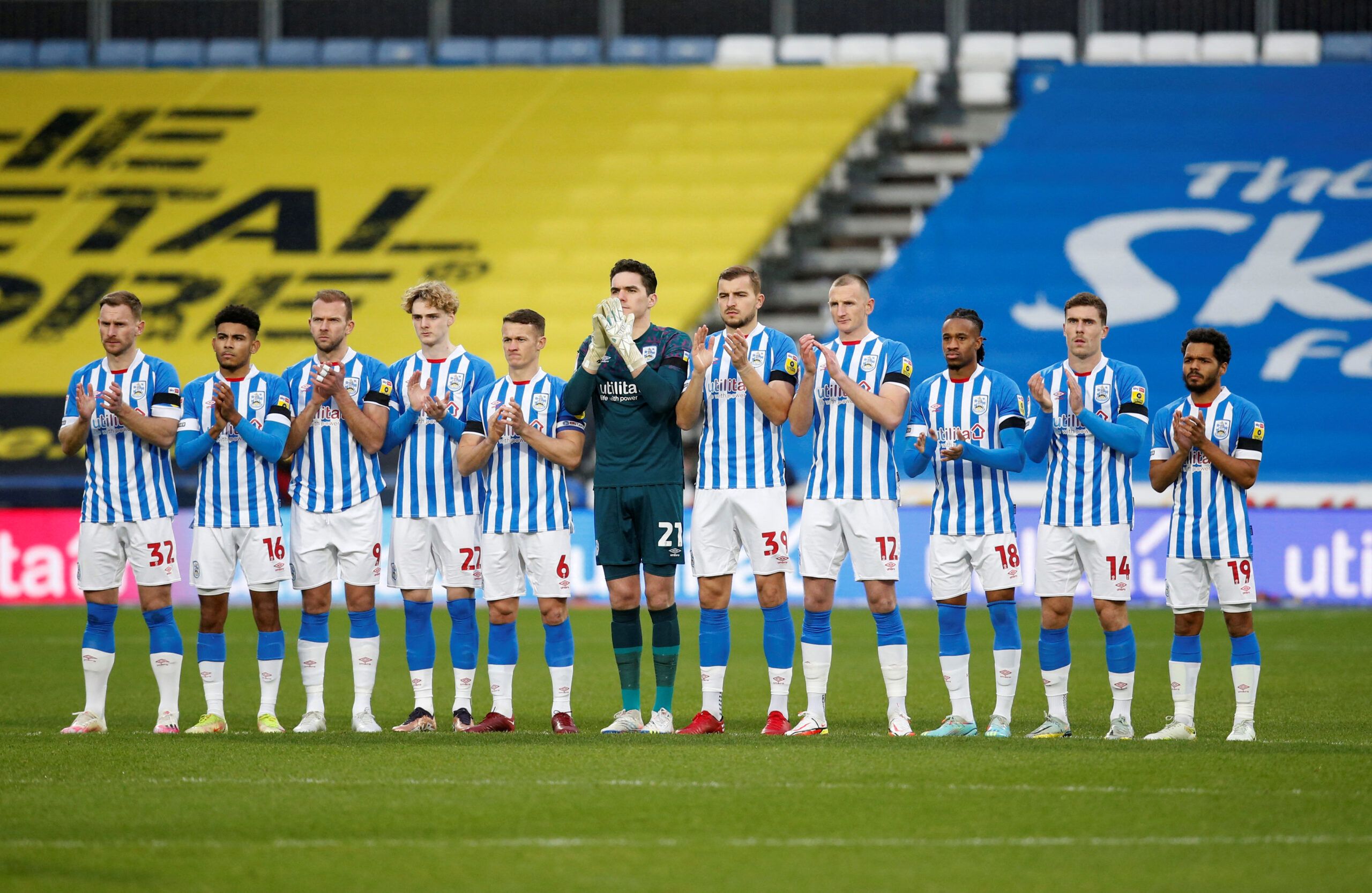 Soccer Football - Championship -  Huddersfield Town v Luton Town - John Smith's Stadium, Huddersfield, Britain - January 1, 2023 Huddersfield Town players during a minutes applause in memory of Brazil ledgend Pele  Action Images via Reuters/Ed Sykes  EDITORIAL USE ONLY. No use with unauthorized audio, video, data, fixture lists, club/league logos or 