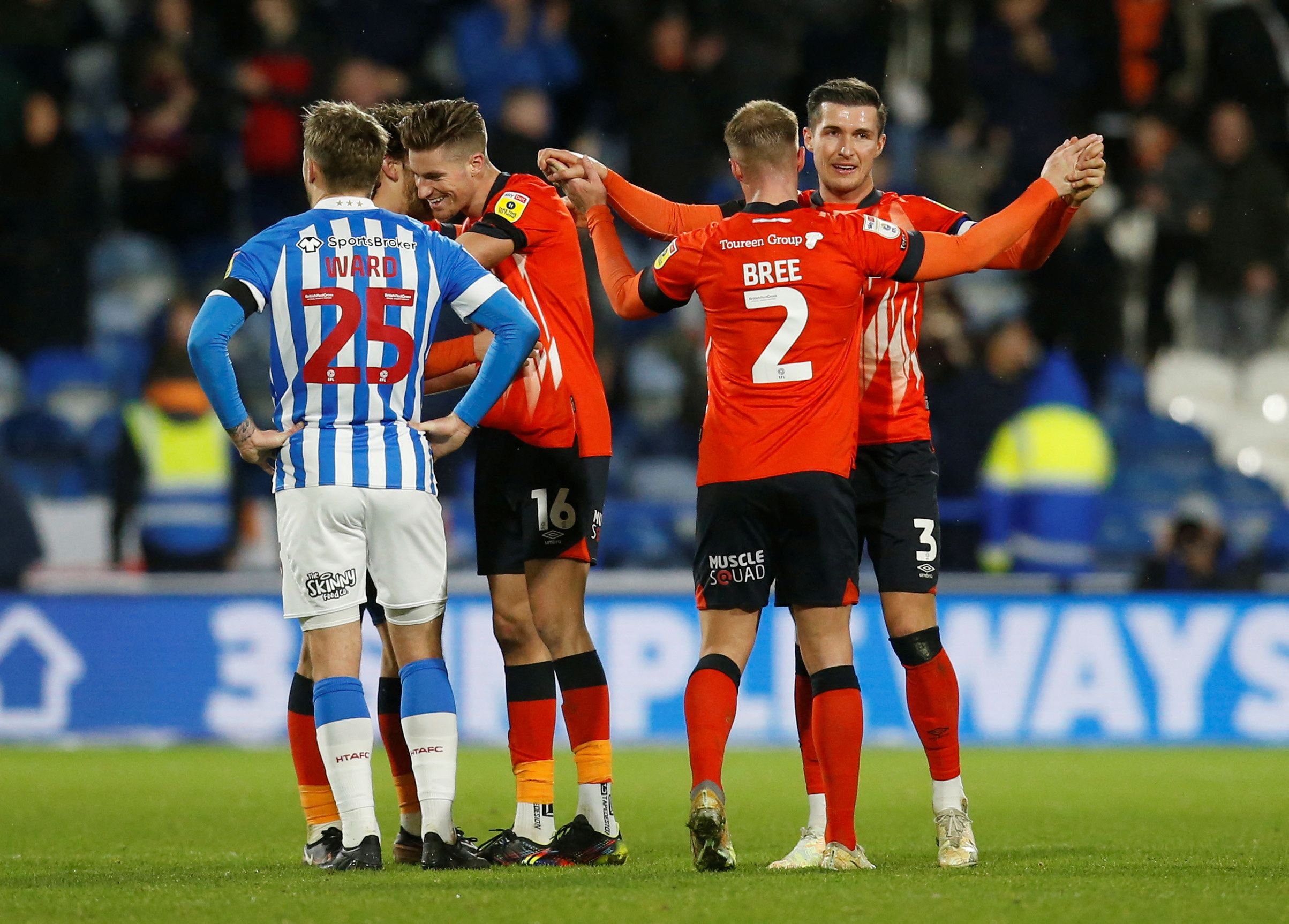 Soccer Football - Championship -  Huddersfield Town v Luton Town - John Smith's Stadium, Huddersfield, Britain - January 1, 2023 Luton Town's Dan Potts and James Bree celebrate after the match   Action Images/Ed Sykes  EDITORIAL USE ONLY. No use with unauthorized audio, video, data, fixture lists, club/league logos or 