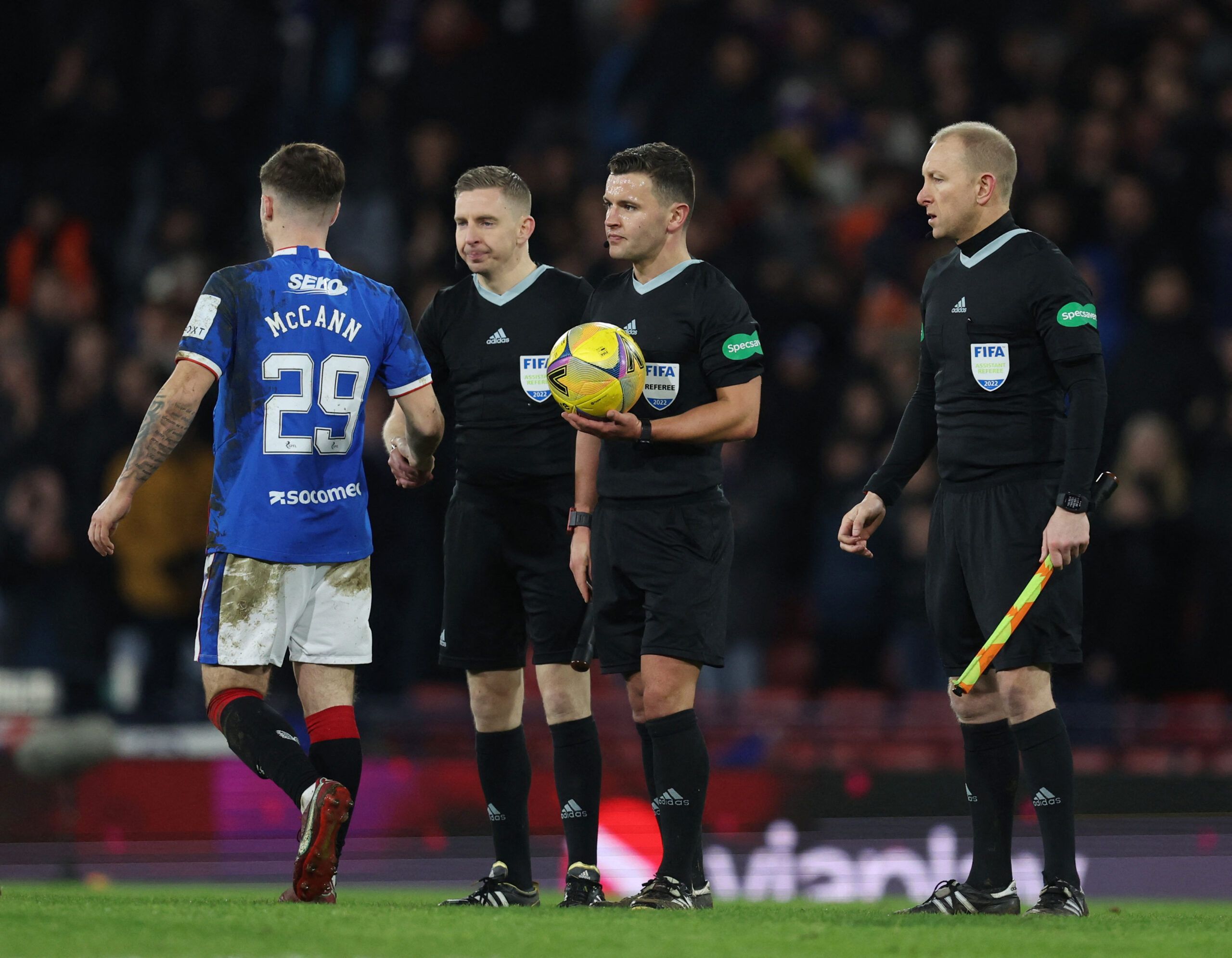 Soccer Football - Scottish League Cup - Semi Final - Rangers v Aberdeen - Hampden Park, Glasgow, Scotland, Britain - January 15, 2023 Rangers' Charlie Mccann with referee Nick Walsh and the assistant referees after the match REUTERS/Russell Cheyne