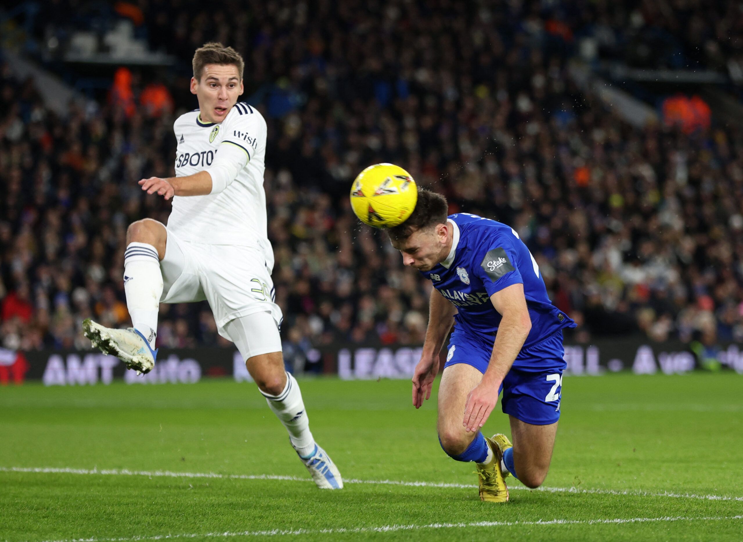 Soccer Football - FA Cup - Leeds United v Cardiff City - Elland Road, Leeds, Britain - January 18, 2023 Cardiff City's Mark Harris in action with Leeds United's Maximilian Wober Action Images via Reuters/Lee Smith