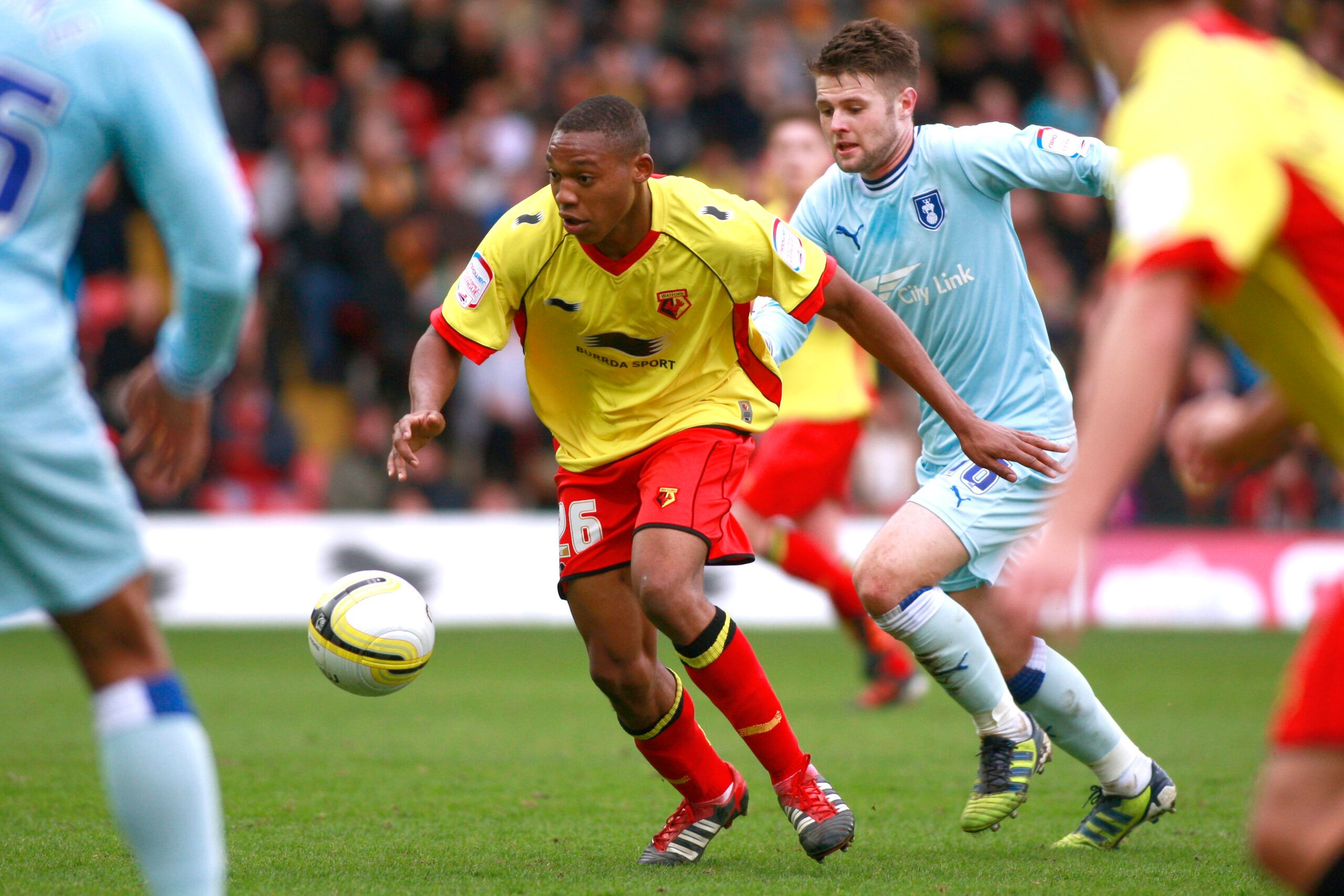 Football - Watford v Coventry City npower Football League Championship  - Vicarage Road - 11/12 , 17/3/12 
Britt Assombalonga - Watford in action against Oliver Norwood - Coventry City 
Mandatory Credit: Action Images / Lee Mills 
EDITORIAL USE ONLY. No use with unauthorized audio, video, data, fixture lists, club/league logos or live services. Online in-match use limited to 45 images, no video emulation. No use in betting, games or single club/league/player publications.  Please contact your ac