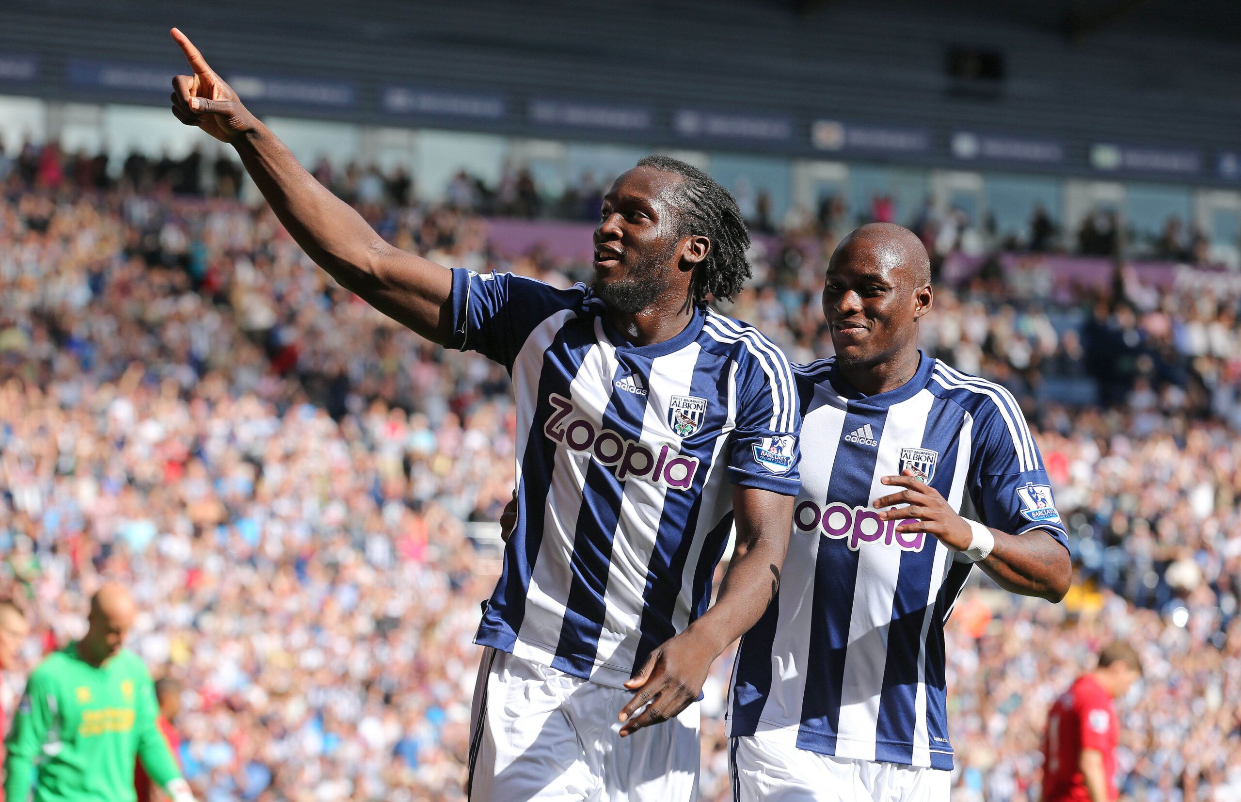 Football - West Bromwich Albion v Liverpool - Barclays Premier League - The Hawthorns - 18/8/12 
Romelu Lukaku (L) celebrates scoring the third goal for West Brom with Marc Antoine Fortune 
Mandatory Credit: Action Images / Carl Recine 
Livepic 
EDITORIAL USE ONLY. No use with unauthorized audio, video, data, fixture lists, club/league logos or live services. Online in-match use limited to 45 images, no video emulation. No use in betting, games or single club/league/player publications.  Please 