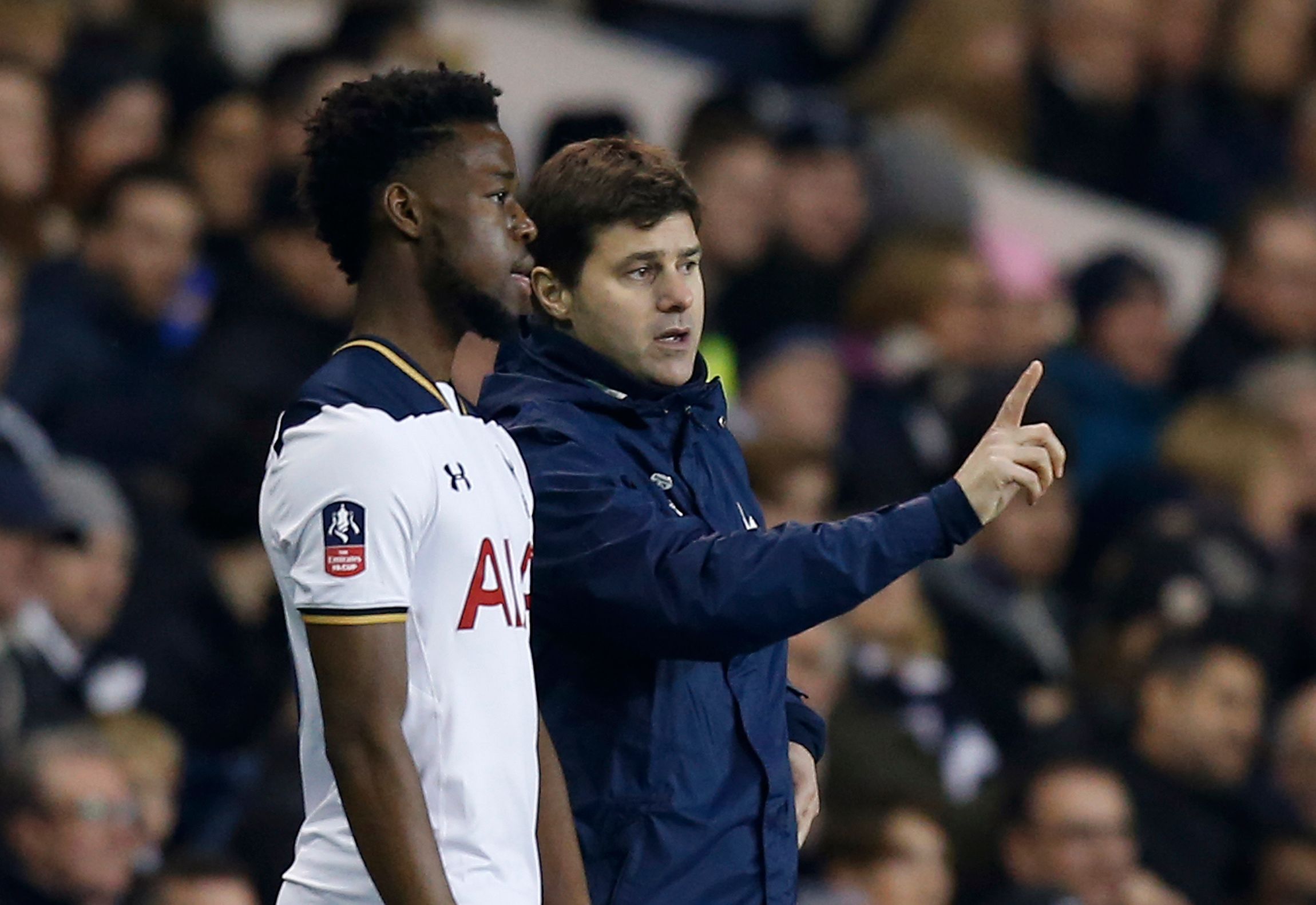 Britain Football Soccer - Tottenham Hotspur v Aston Villa - FA Cup Third Round - White Hart Lane - 8/1/17 Tottenham manager Mauricio Pochettino with Josh Onomah as he prepares to come on  Action Images via Reuters / Paul Childs Livepic EDITORIAL USE ONLY. No use with unauthorized audio, video, data, fixture lists, club/league logos or 
