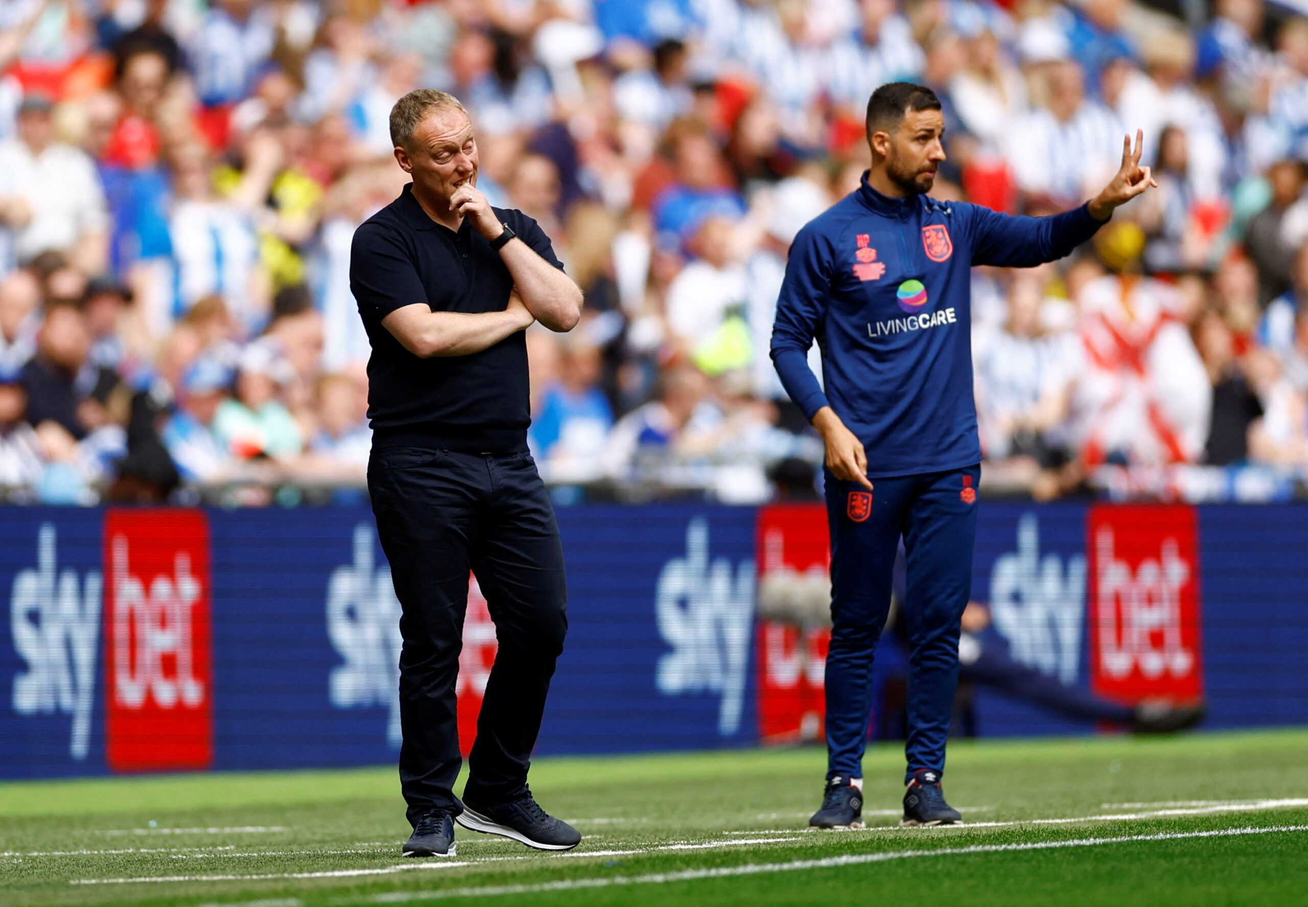 Soccer Football - Championship Play-Off Final - Huddersfield Town v Nottingham Forest - Wembley Stadium, London, Britain - May 29, 2022 Nottingham Forest manager Steve Cooper and Huddersfield Town assistant manager Narcis Pelach Action Images via Reuters/Andrew Boyers REFILE - CORRECTING ID